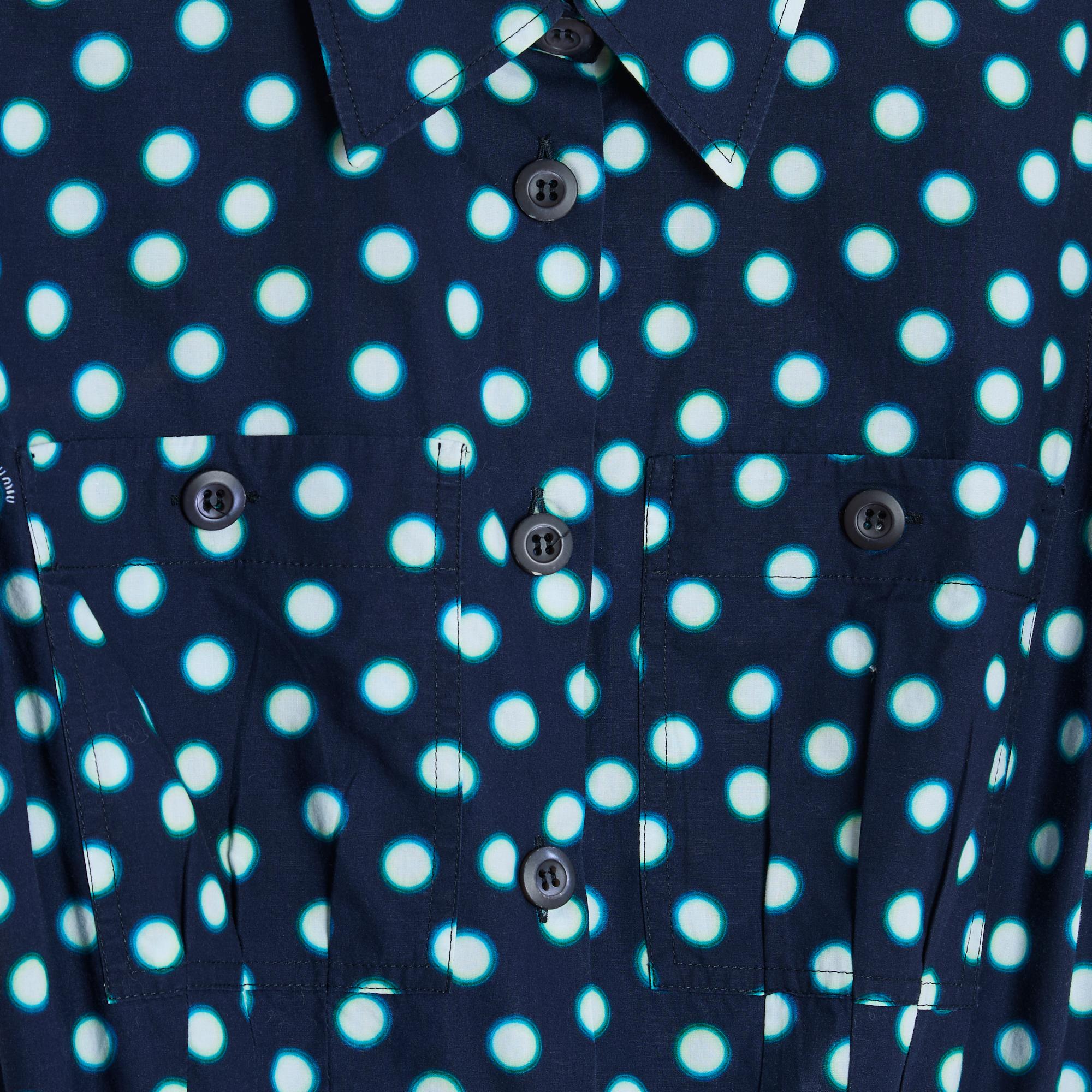 Miu Miu dress in navy blue cotton with white polka dot pattern edged in green, shirt collar closed with 9 buttons along the entire length of the dress, 2 patch and buttoned pockets on the chest, short sleeves also buttoned, skater-shaped skirt,