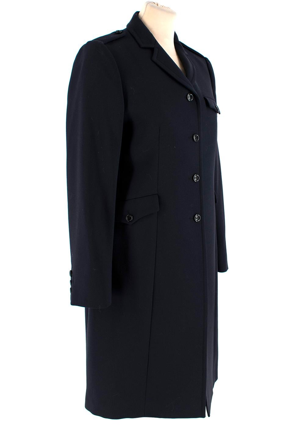 Miu Miu Navy Wool Military Single Breasted Coat

-Smooth stripe textured wool 
-Military inspired 
-3 buttoned flap pockets to the front 
-Button fastening to the front 
-Button embellished cuffs 
-Pleat detail to the back 
-Fully lined