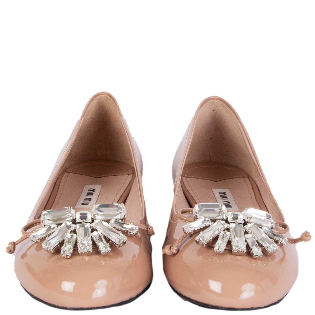 100% authentic Miu Miu ballet flats in nude patent leather embellished with Swarovski crystals at tip. Brand new. Come with dust bag. 

Measurements
Imprinted Size	37
Shoe Size	37
Inside Sole	24cm (9.4in)
Width	7.5cm (2.9in)
Heel	1.5cm