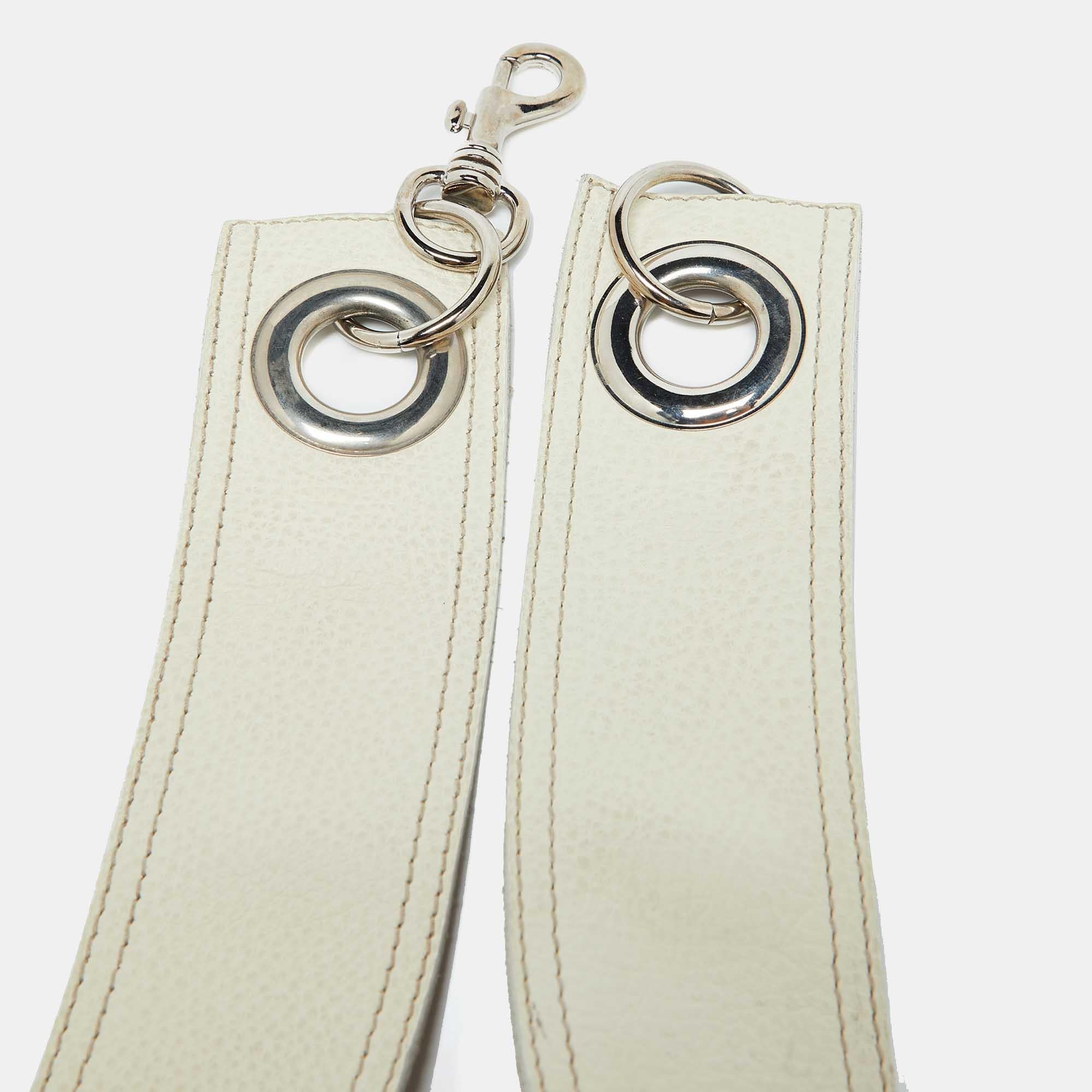 This Miu Miu belt is the perfect addition to your accessory collection. Crafted in soft off white leather this embellished buckle belt will provide you with enough to glam up any basic outfit.