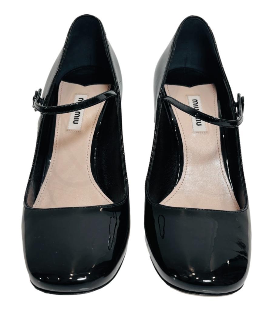 Miu Miu Patent Leather Mary Jane Pumps

Black heels designed with a squared toe and buttoned strap to the vamp.

Detailed with curved, block heel and leather insoles.

Size – 40.5

Condition – Good (Scratches to the leather)

Composition – Patent