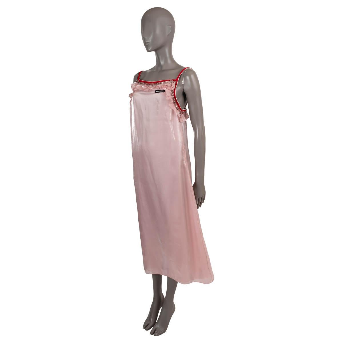100% authentic Miu Miu slip dress in pink voile polyester (100% - please note the content tag is missing). Features a square neck, A-line silhouette, spaghetti straps, a logo label and a crystal embellished ruffle trim. Opens with a concealed zipper