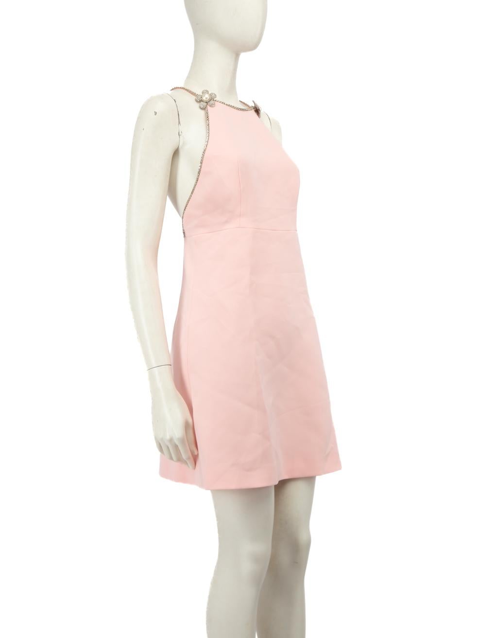 CONDITION is Never worn, with tags. Due to poor storage of the dress, wear is evident to the right pearl on the flower embellishment with minor scratches and there is a rhinestone missing behind the left flower on this new Miu Miu designer resale