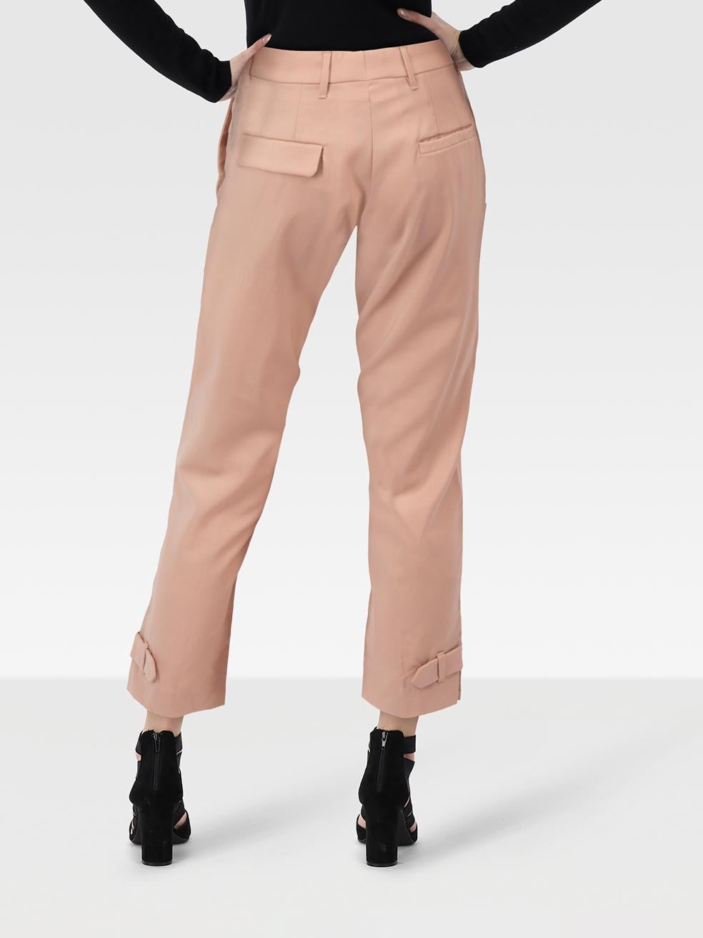 CONDITION is Good. Minor wear to the trousers is evident. Discolouration to the inside of the waist band, front of the left trouser leg and back of the right. Small hole on the left leg hem on this used Miu Miu designer resale item.
 
 
 
 
