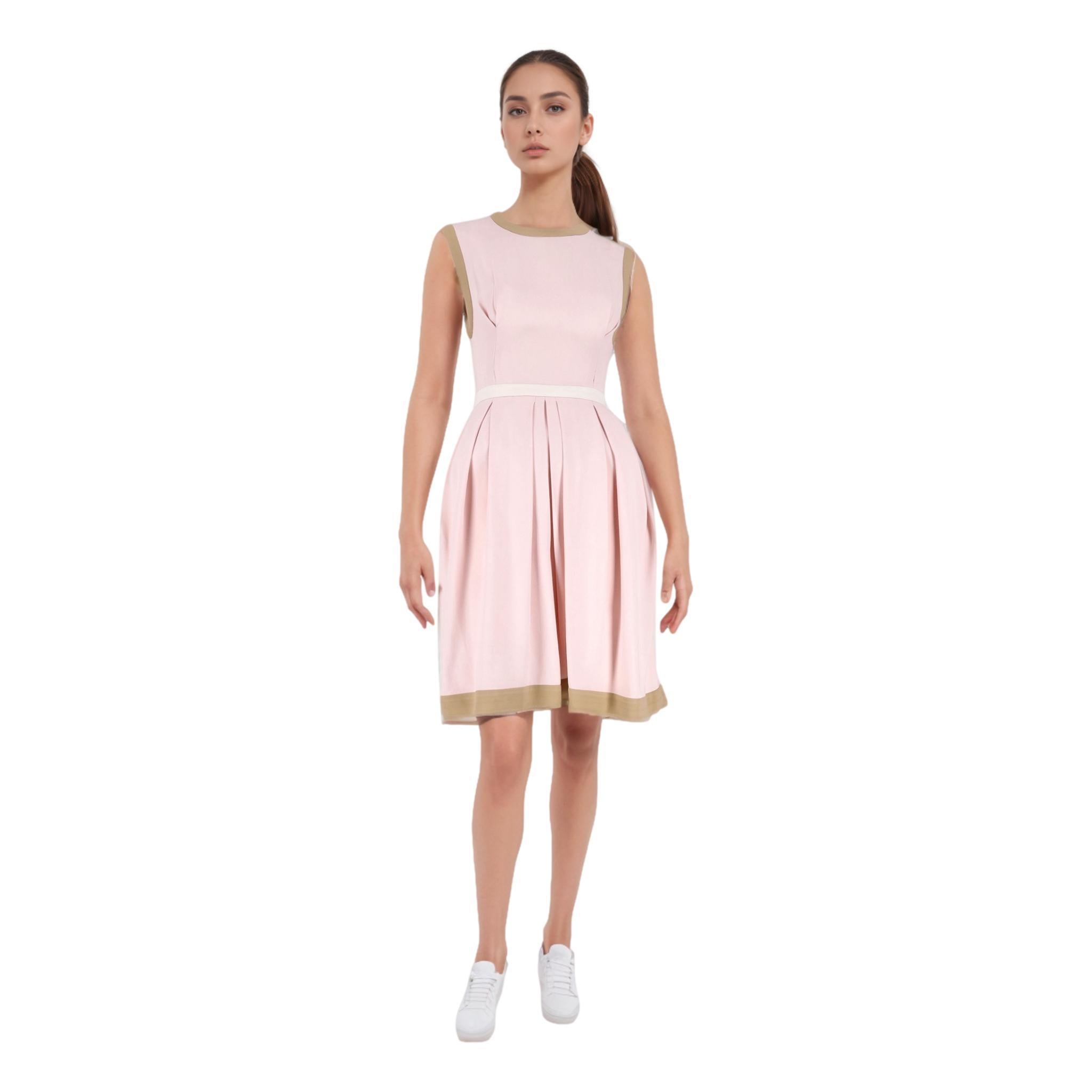 Miu Miu Pleated Dress

Light pink sleeveless dress designed with pleated knee-length skirt.

Styled with nude trims, white waist band and cut-out detail to rear.

Featuring crew, neckline with zip and hook closure. and side pockets.

Rrp Approx.