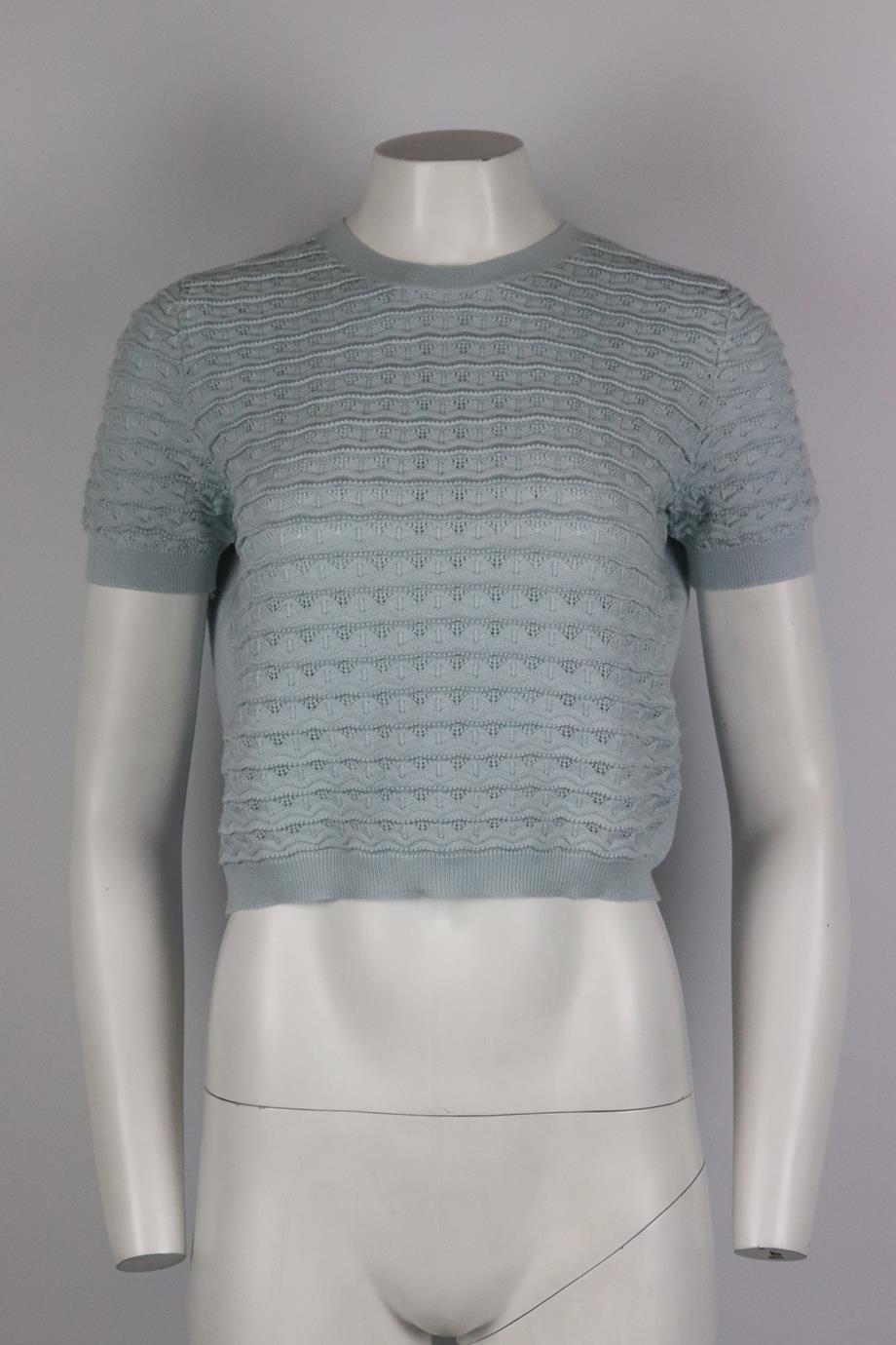 Miu Miu pointelle knit cashmere blend sweater. Blue. Short sleeve, crew neck. Pull on. 70% Cashmere, 30% silk. Size: IT 42 (UK 10, US 6, FR 38). Bust: 37 in. Waist: 35 in. Hips: 30 in. Length: 17 in. Very good condition - No sign of wear; see