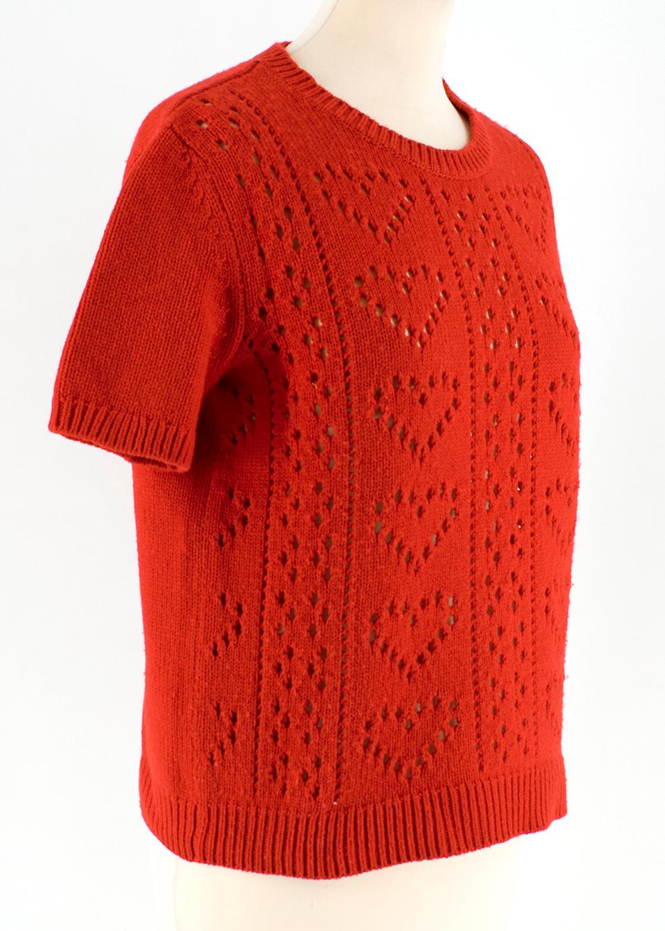 Miu Miu Red Wool blend Heart Sweater

- red wool blend sweater
- knit cutouts in heart shape
- short sleeve
- unlined
- pull on 

Please note, these items are pre-owned and may show some signs of storage, even when unworn and unused. This is