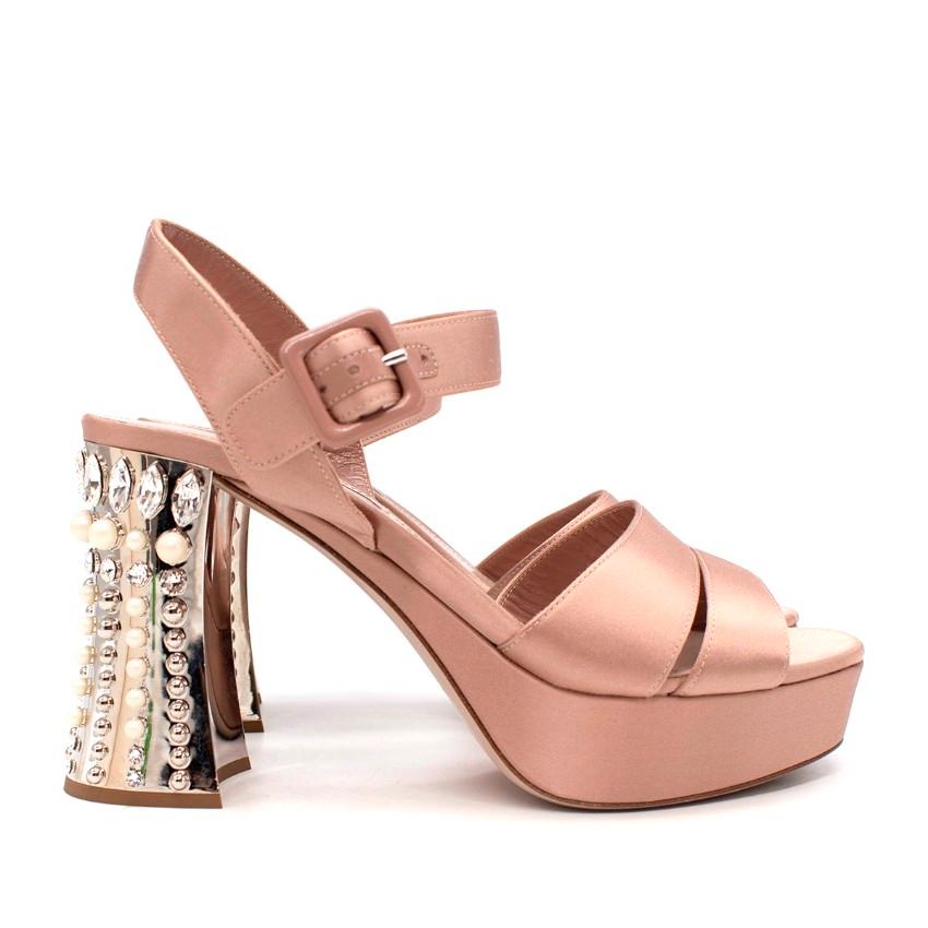 Miu Miu Powder Pink Satin Faux Pearl & Crystal Block Heeled Sandals
 

 - Pale pink satin covered block heel sandals, with a double foot strap, and fully adjustable ankle strap
 - Flared silver-tone block heel decorated with faux-pearl and crystal