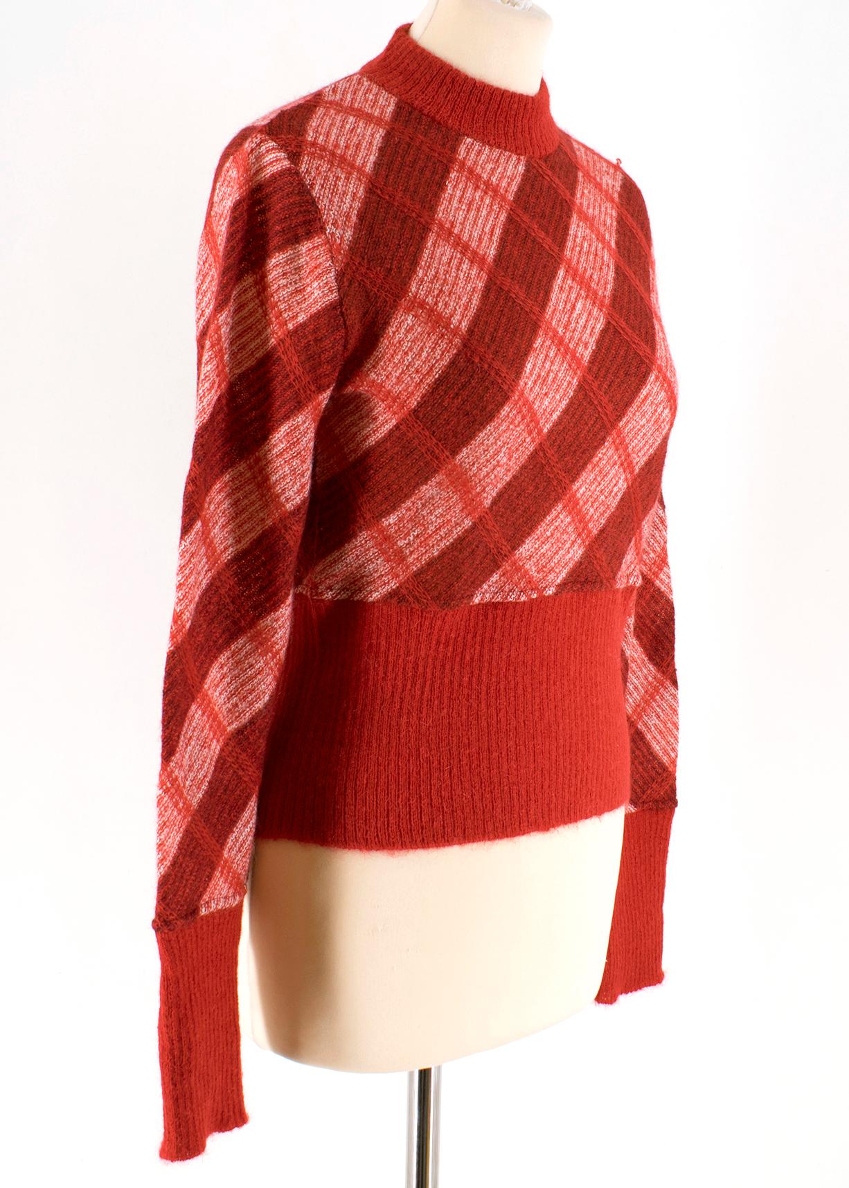 Miu Miu Red Check Mohair Crop Knit Sweater

- red mohair sweater
- check pattern
- crop length
- long sleeve
- unlined
- round neckline

Please note, these items are pre-owned and may show some signs of storage, even when unworn and unused. This is