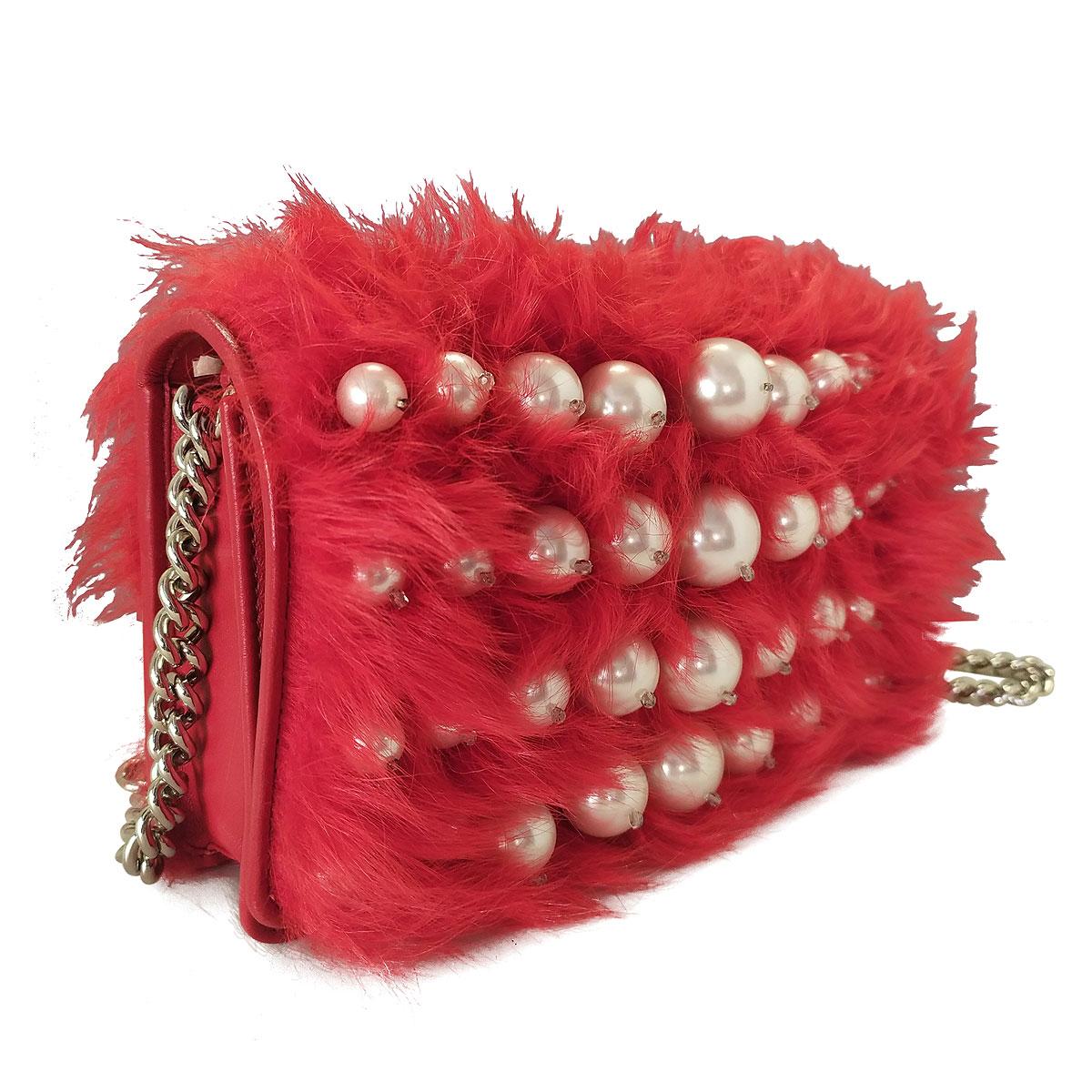 Funny and rare Miu Miu pochette
Mutton leather an fur
Red color
Detachable chain shoulder strap
Pearls decoration
Magnetic closure with automatic buttons
Different side spaces for cards
Removable metal mirror
Certificate of authenticity and