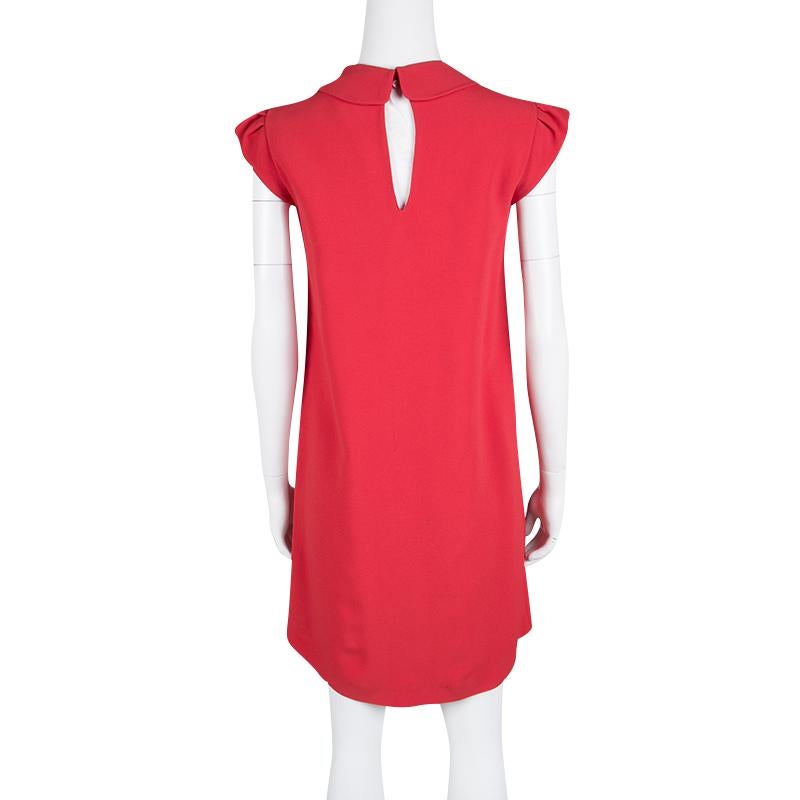 A splendid balance of comfort and style, this blended fabric dress is an apparel you must own. This Miu Miu dress has cap sleeves, embellishments on its Peter Pan collar and is secured by a buttoned closure. In an attractive red, this dress is