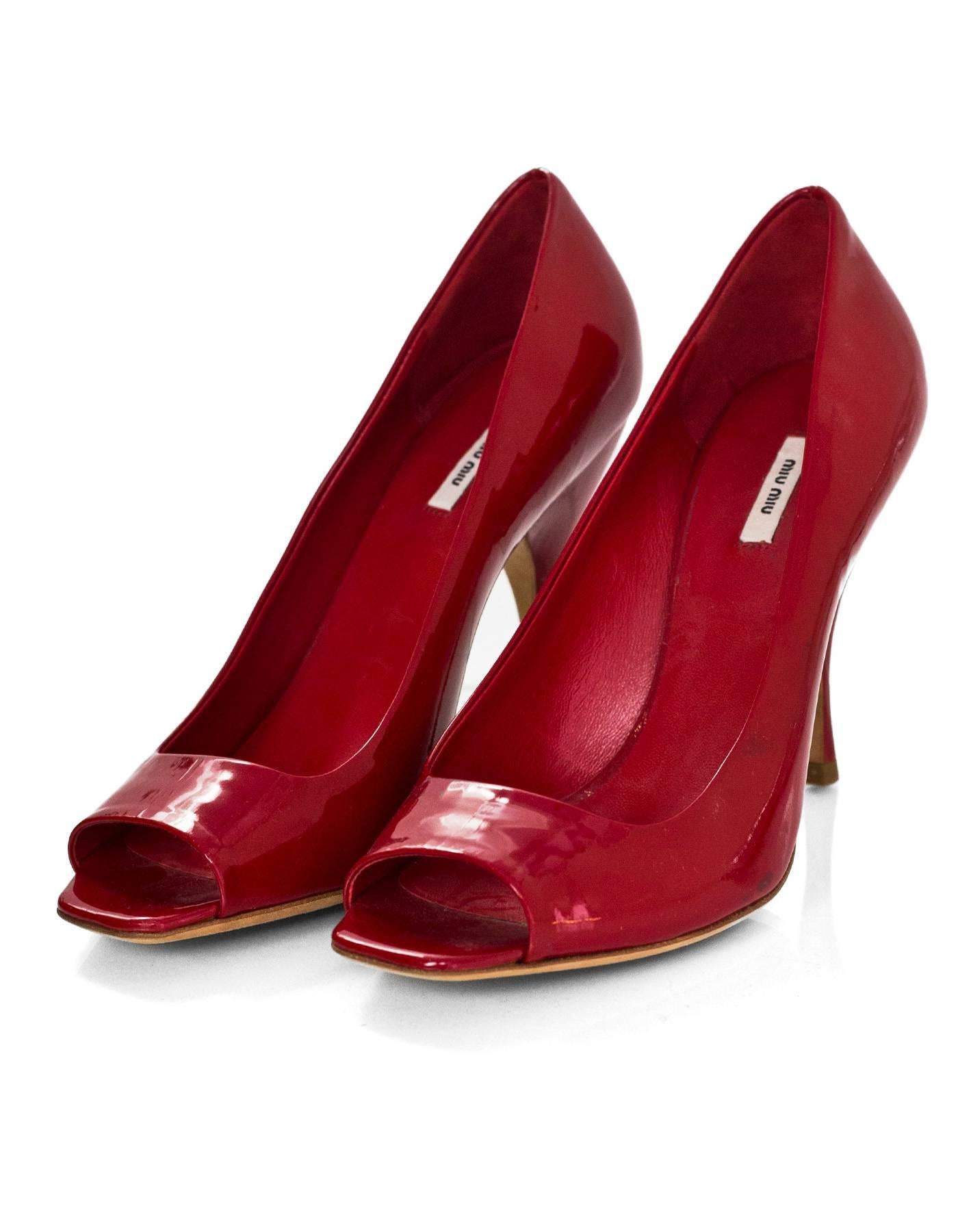 Miu Miu Red Patent Open-Toe Pumps Sz 35.5

Made In: Italy
Color: Red
Materials: Patent leather
Closure/Opening: Slide on
Sole Stamp: Miu Miu Made in Italy 35.5
Overall Condition: Excellent pre-owned condition with the exception of light wear at