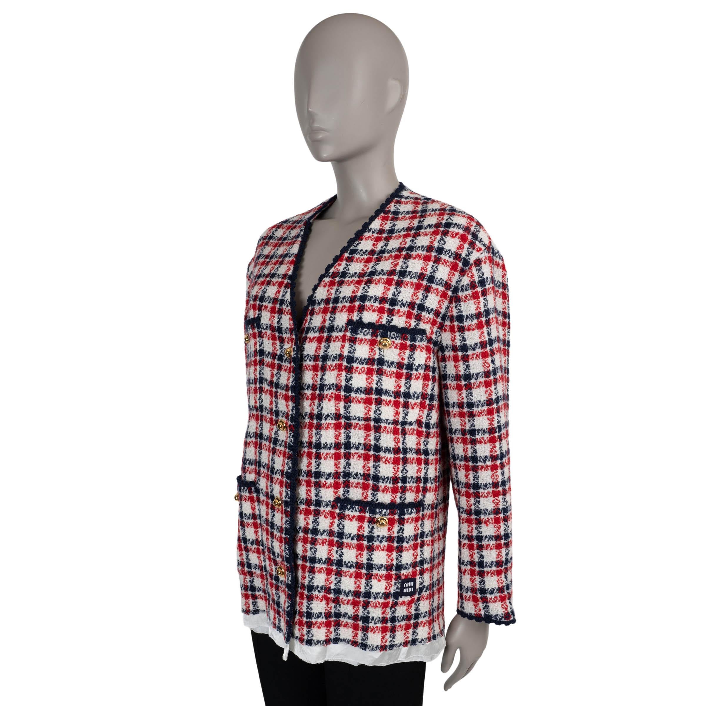 This 100% authentic Miu Miu mini jacket in red, white, and blue plaid tweed wool (100%) reinterprets classic tailoring with a playful edge. Designed with a straight cut, it features an exposed raw-finished white acetate-cupro lining for a