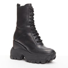 MIU MIU Runway black leather logo lace up chunky wedged military boots EU39