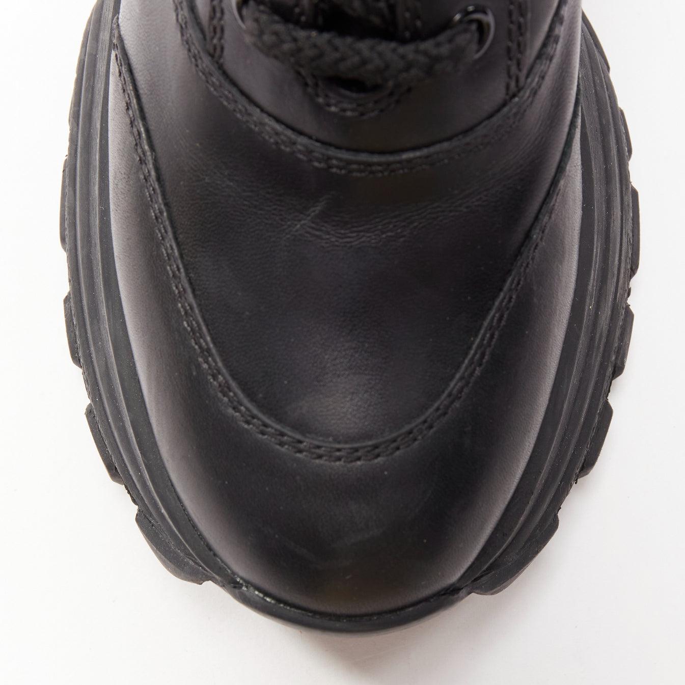 MIU MIU Runway bottes militaires à talons compensés en cuir noir avec logo, EU39 en vente 2
