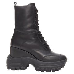 MIU MIU Runway black leather logo lace up chunky wedged military boots EU39