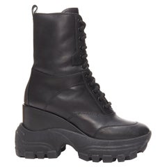 MIU MIU Runway black leather logo lace up chunky wedged military boots EU39