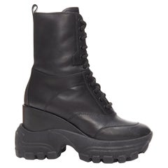 MIU MIU Runway schwarzes Leder Logo Schnürung klobig keilförmige Militärstiefel EU39