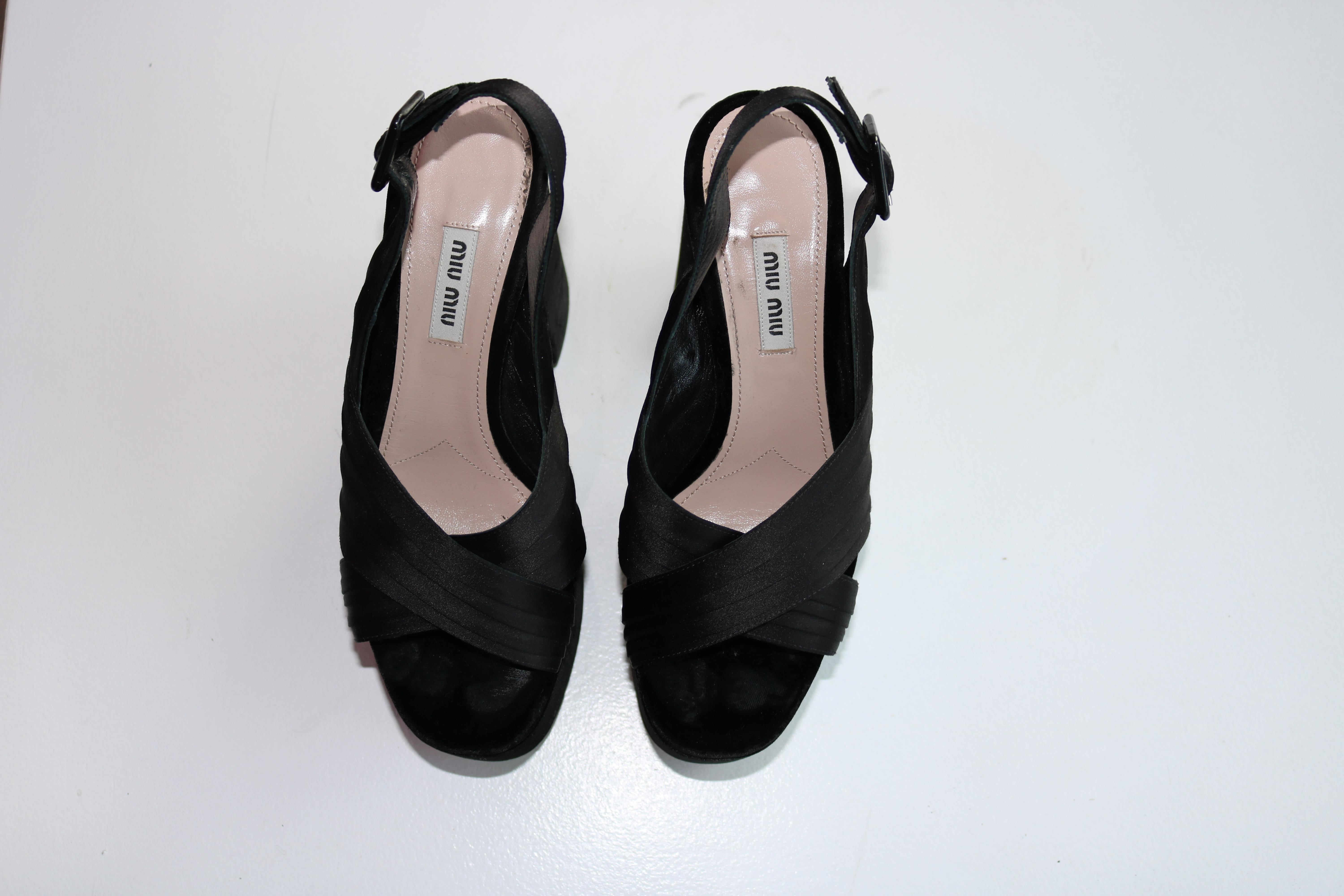 Miu Miu satin sandal with velvet trim.
5