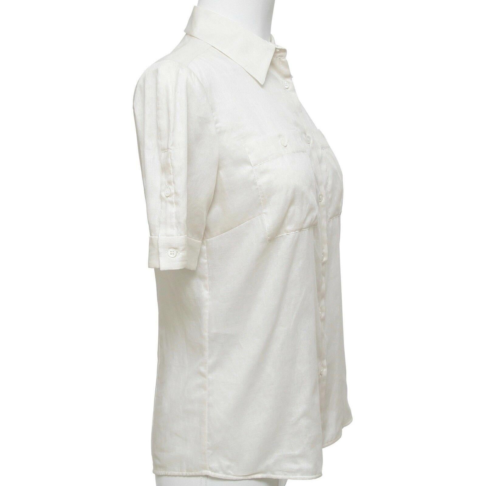GUARANTEED AUTHENTIC CHIC MIU MIU IVORY COTTON BUTTON DOWN BLOUSE


Details:
o Ivory semi-sheer buddon down front cotton top.
o Short sleeve, buttons on each sleeve.
o Dual front pockets.
o Comes with extra button.

Fabric: 100% Cotton

Size: