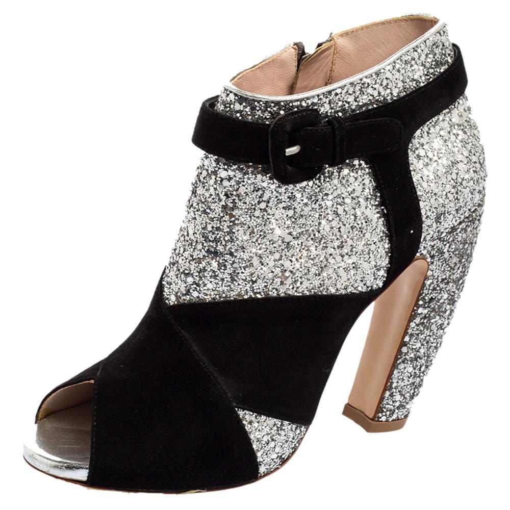 A feminine flair and a sophisticated appeal characterize these stunning Miu Miu ankle boots. Crafted using quality materials, they will add an opulent charm to your look and complement many looks that you would want to create.