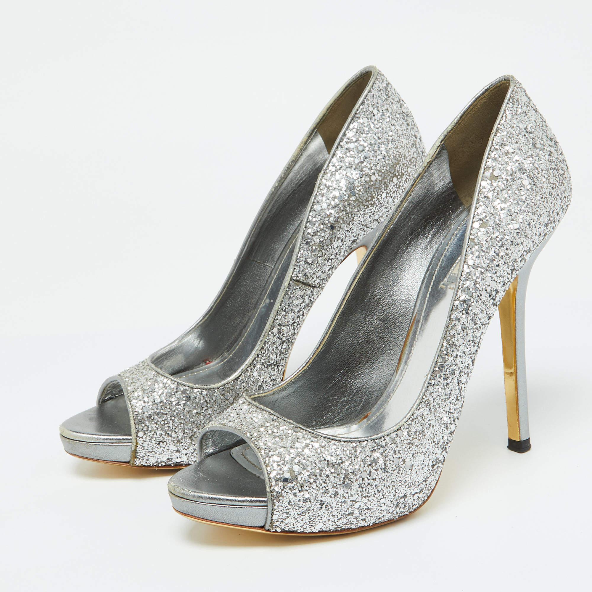 Bursting with sparkles Miu Miu made these pumps to catch ones eye. They are designed with silver glitter peep toes and 13 cm heels.
