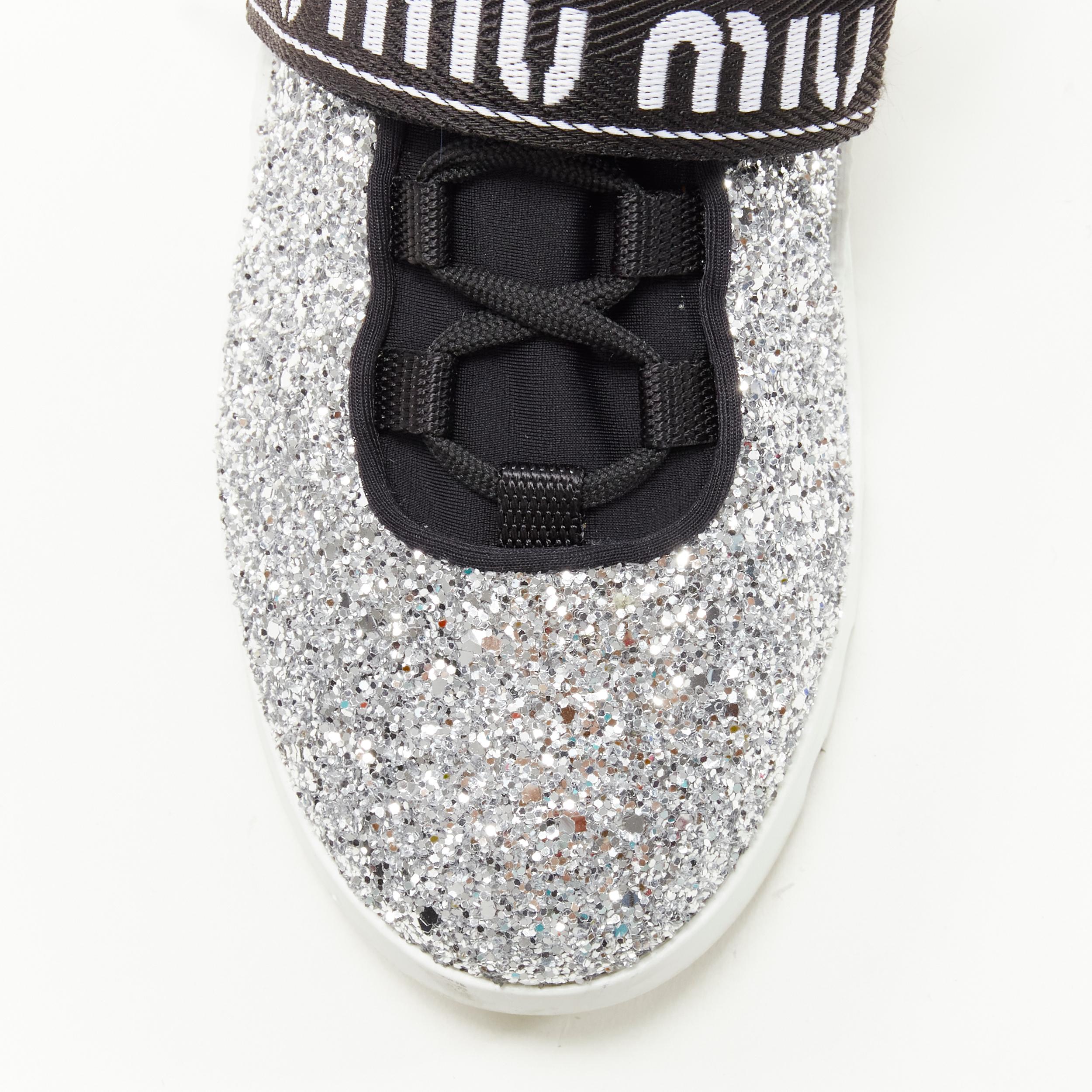 Silver MIU MIU silver glitter logo strap low top runner sneaker EU36 For Sale