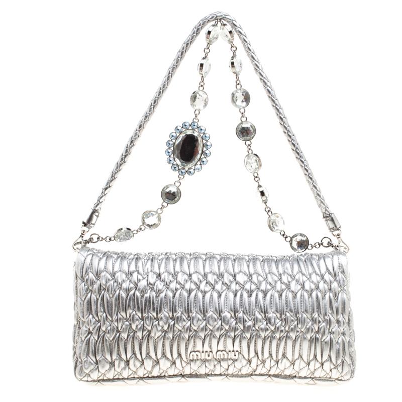 Perfect to swing at special events, this shoulder bag from Miu Miu is a must-have! Crafted from Matelassé leather, the bag features a flap with crystals embellished on the turn lock and a satin-lined interior fitted with a zip pocket for you to