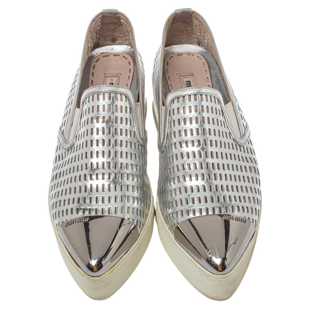 These slip-on sneakers from Miu Miu are amazingly stylish! The silver sneakers have been crafted from perforated leather and feature pointed metal cap toes. They come equipped with comfortable leather-lined insoles and tough rubber soles.

