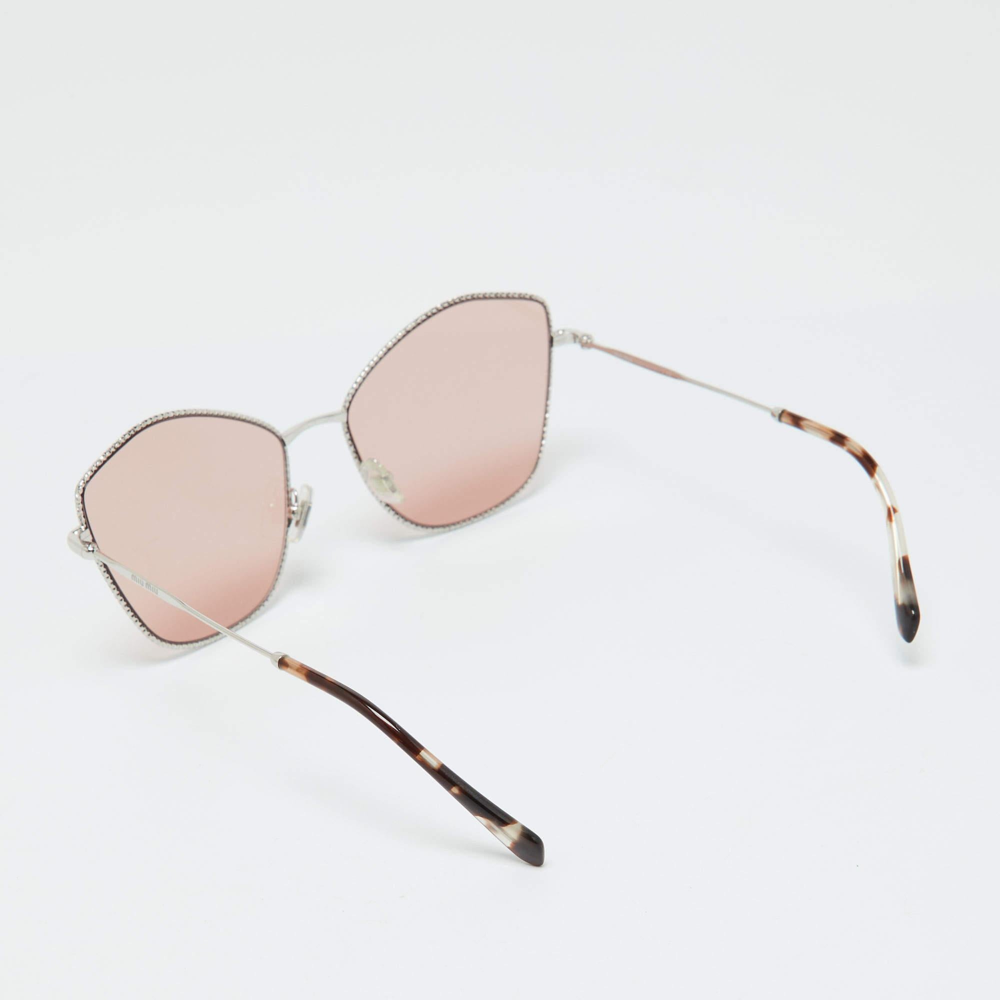 Elevate your eyewear game with these Miu Miu sunglasses. Meticulously crafted from quality materials  they offer unparalleled protection and a sophisticated design  making them a must have accessory for the fashion forward.