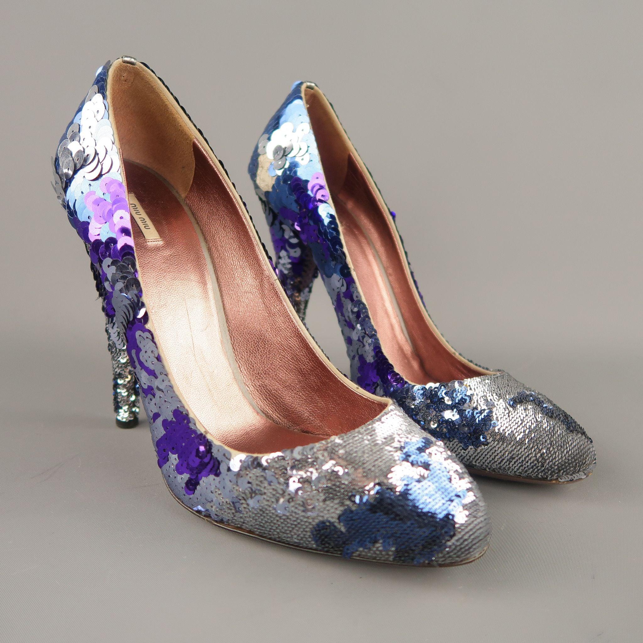 MIU MIU pumps feature silver, blue, and purple sequin overlay in various sizes throughout the entire shoe and heel with a rounded point toe. Small patch of missing sequin on inner heel. As-is. Made in Italy.Good Pre-Owned Condition. 

Marked:   IT