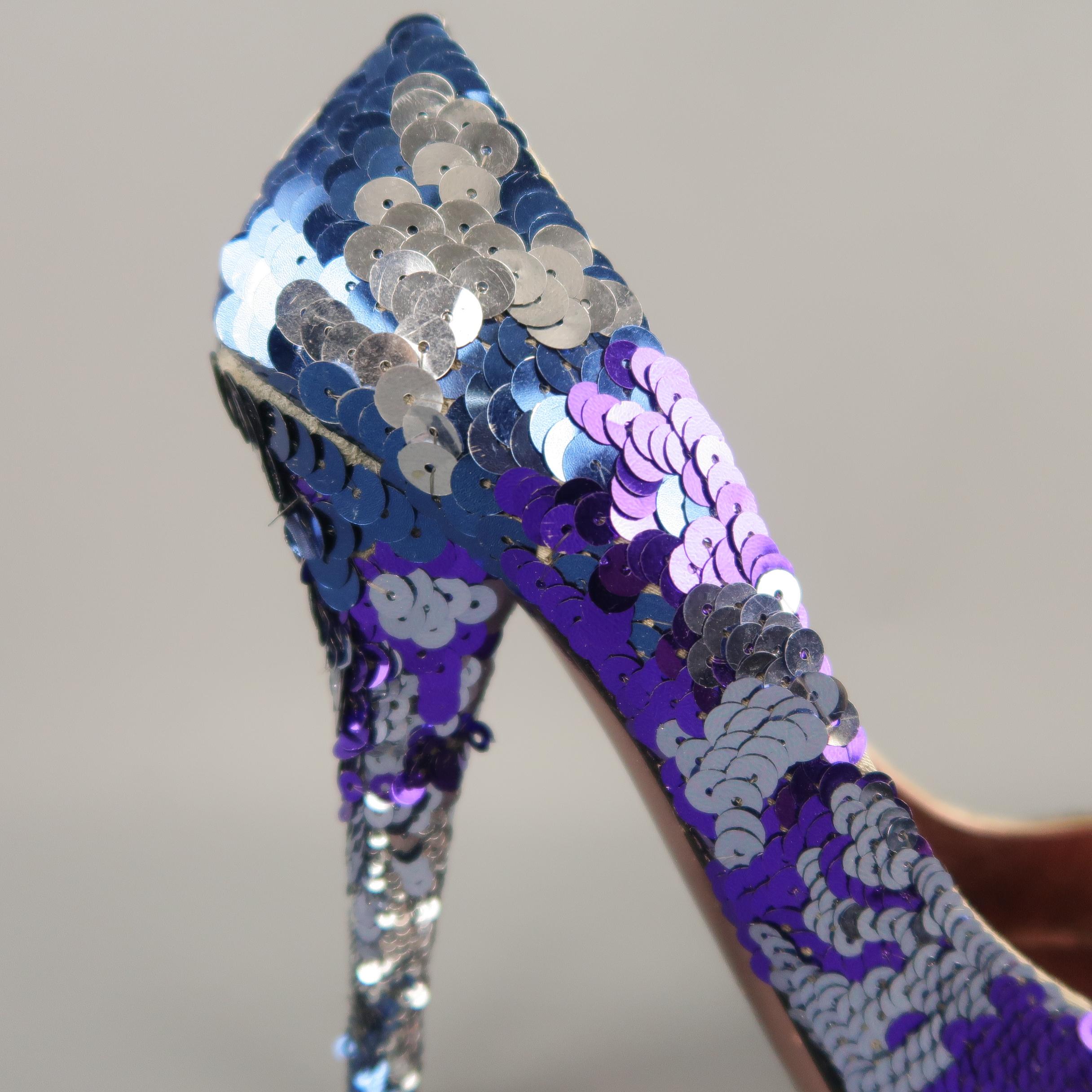 MIU MIU pumps feature silver, blue, and purple sequin overlay in various sizes throughout the entire shoe and heel with a rounded point toe. Small patch of missing sequin on inner heel. As-is. Made in Italy.
 
Good Pre-Owned Condition.
Marked: IT