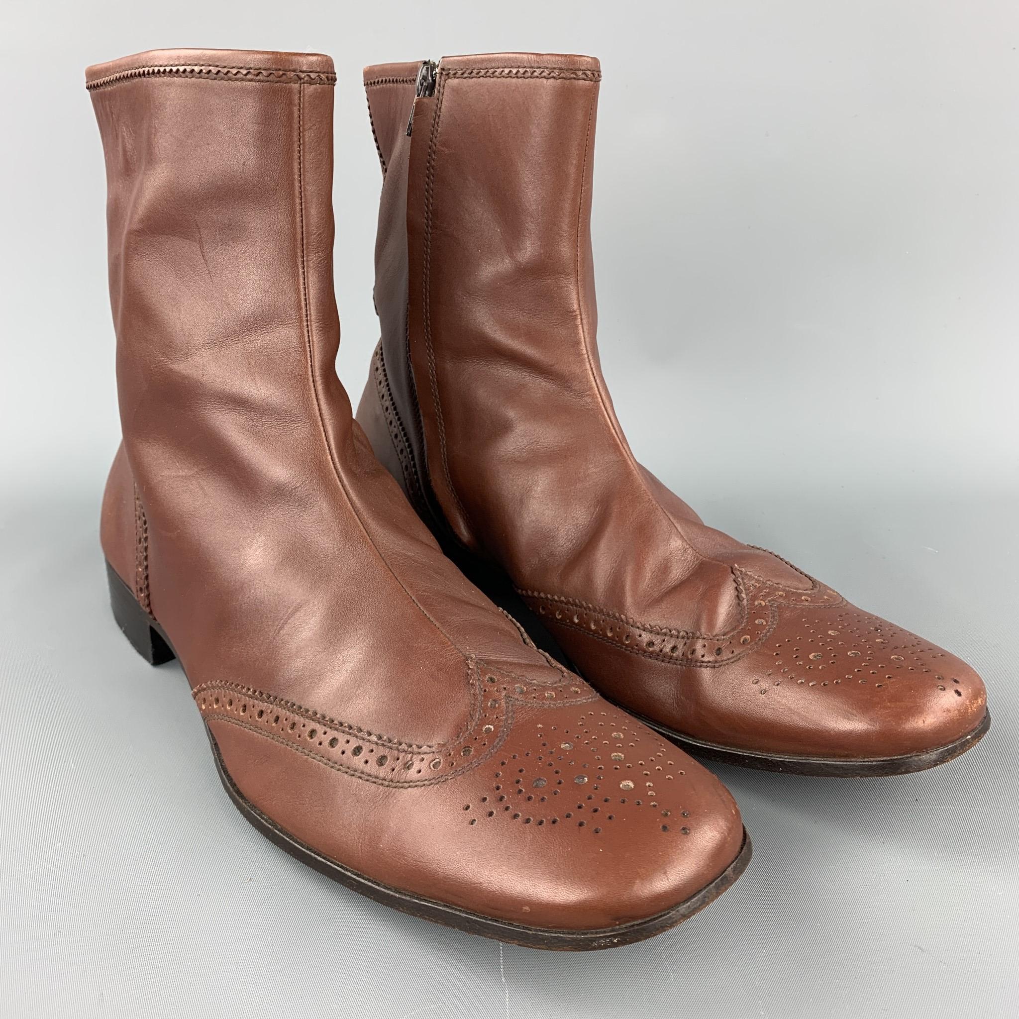 MIU MIU boots comes in a brown perforated leather featuring a wingtip, wooden sole, and a side zipper closure. Made in Italy.

Very Good Pre-Owned Condition.
Marked: 11

Measurements:

Length: 13 in. 
Width: 4 in. 
Height: 8.5 in. 

SKU: