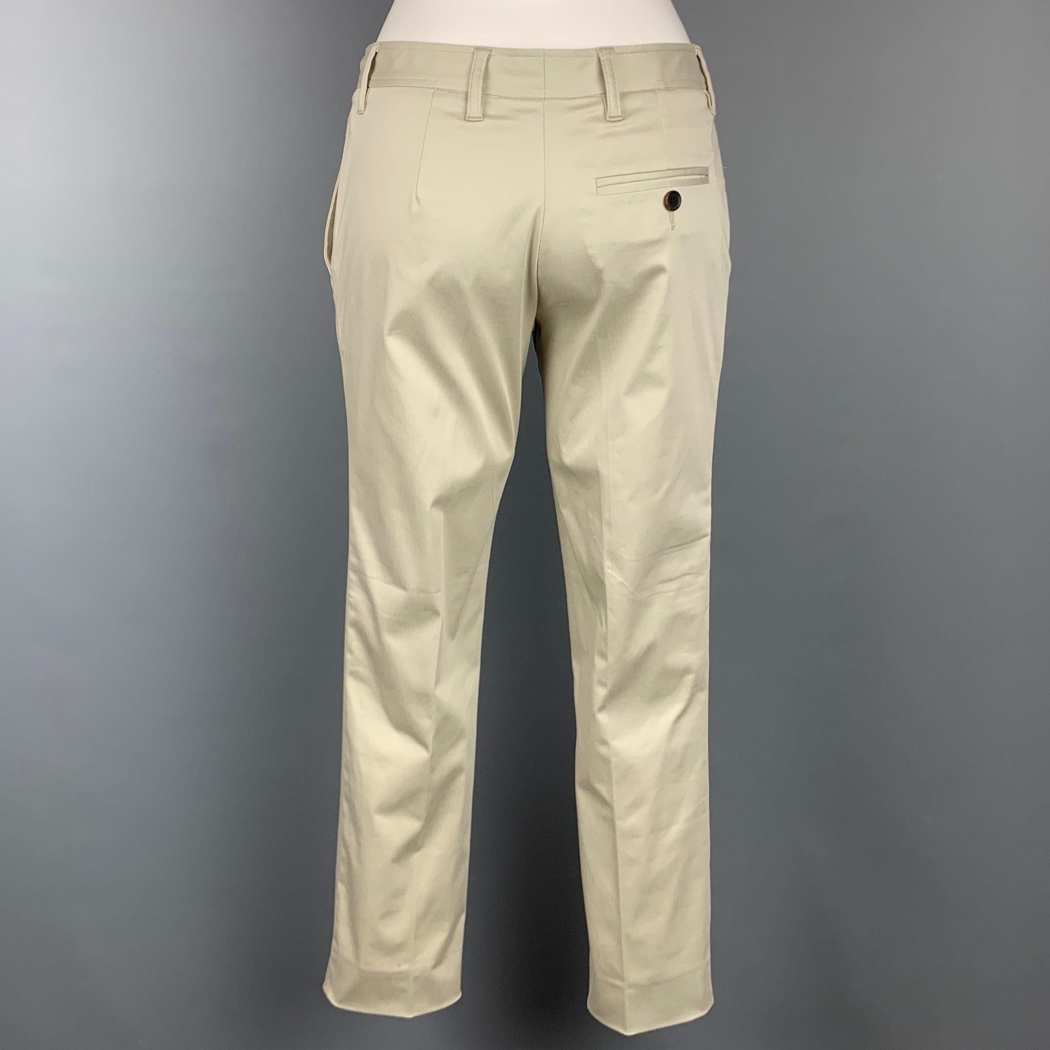 MIU MIU dress pants comes in a beige cotton featuring a narrow leg, front tab, and a zip fly closure. Made in Italy. Good
Pre-Owned Condition. 

Marked:   Missing tag.  

Measurements: 
  Waist: 29 inches  Rise: 8.5 inches  Inseam: 27 inches 
  
  
