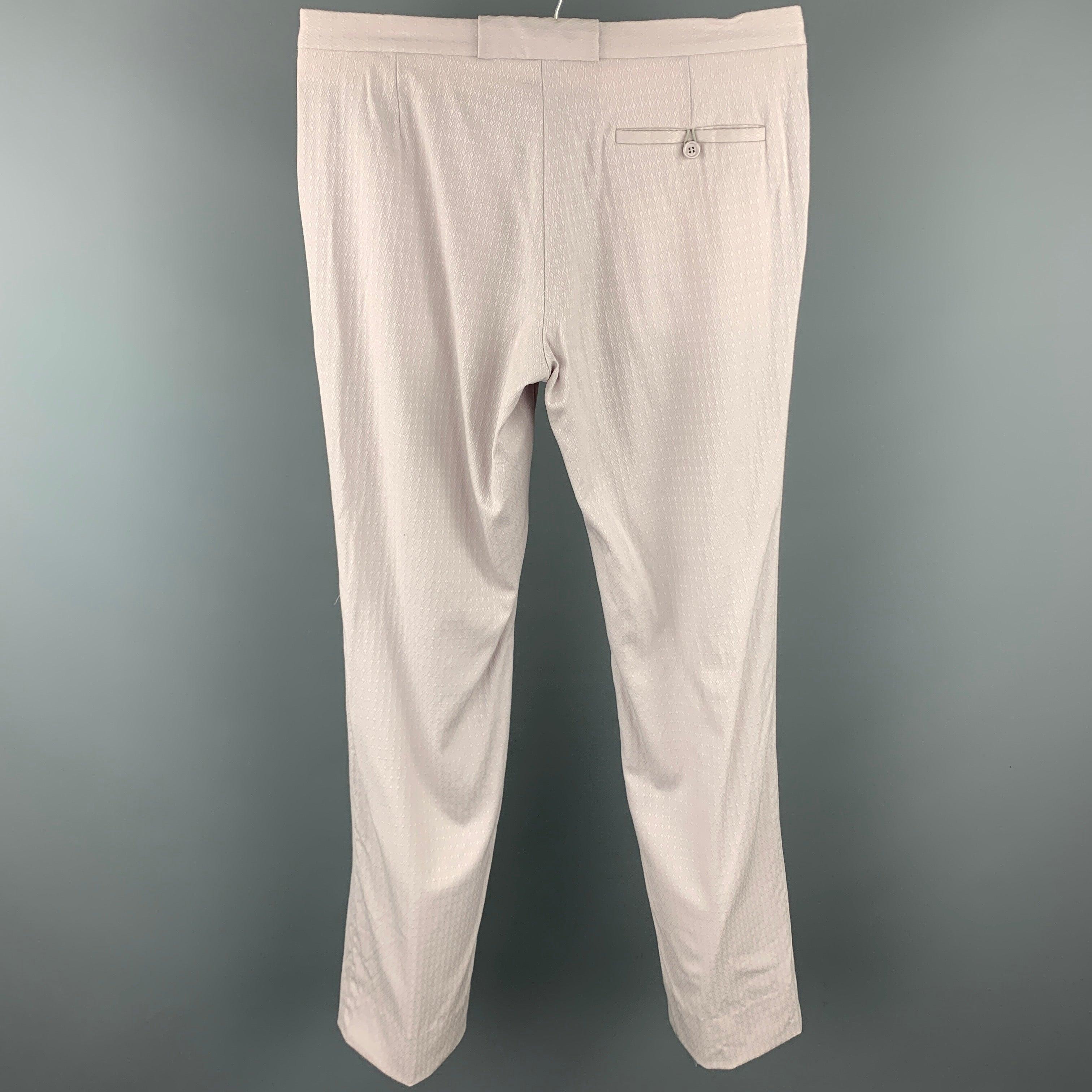 MIU MIU dress pants comes in a lavender textured cotton featuring a flat front, front tab, and a zip fly closure.Good
 Pre-Owned Condition. 
 

 Marked:  No fabric tag 
 

 Measurements: 
  Waist: 33 inches Rise: 9.5 inches Inseam: 34 inches Leg