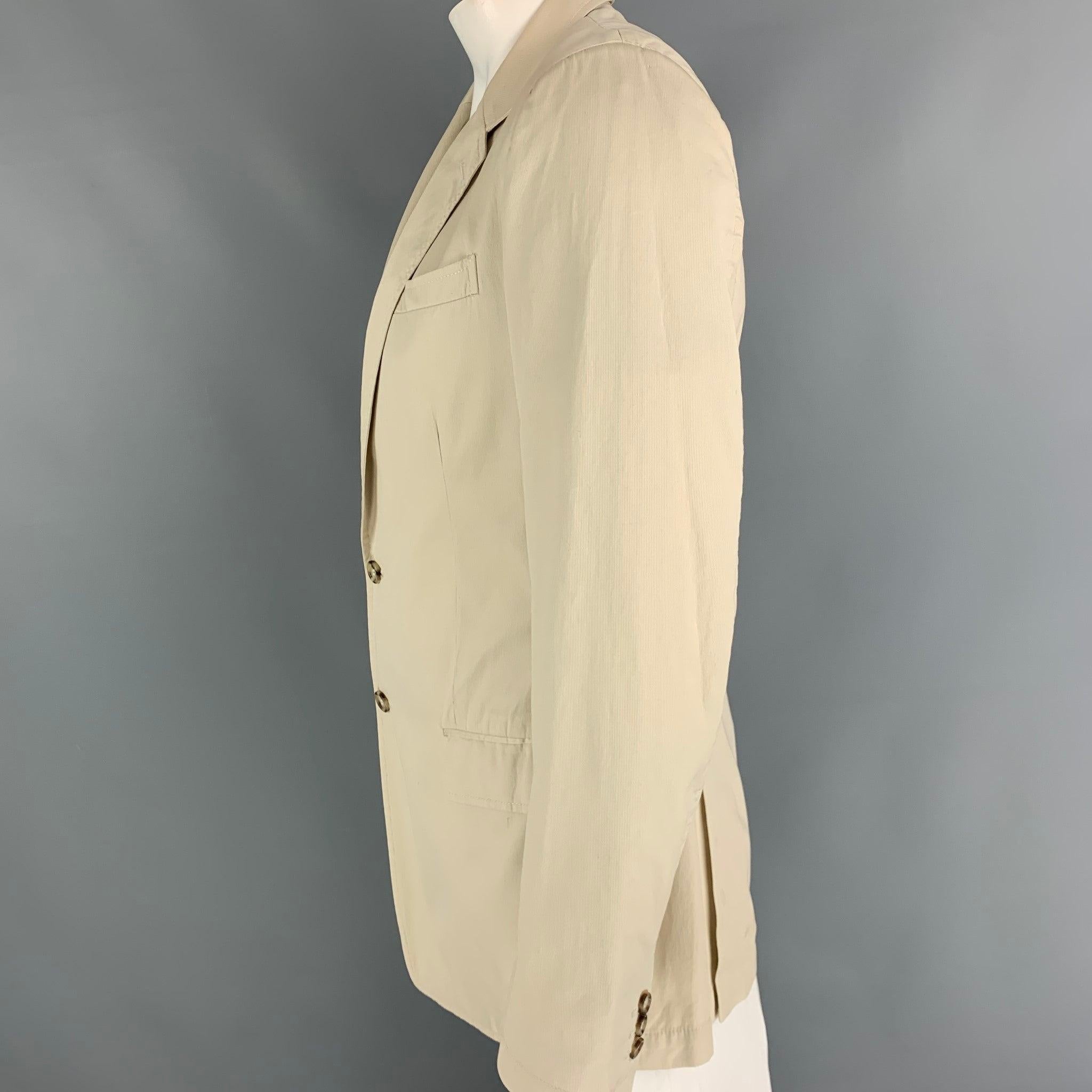 MIU MIU 100% cotton sports coat comes in Beige with a peak lapel,single breasted,double tonal button front.Excellent Pre-Owned Condition.  

Marked:   52 

Measurements: 
 
Shoulder:17 InchesChest:42 InchesSleeve:26/ InchesLength:
31/ Inches
  
  

