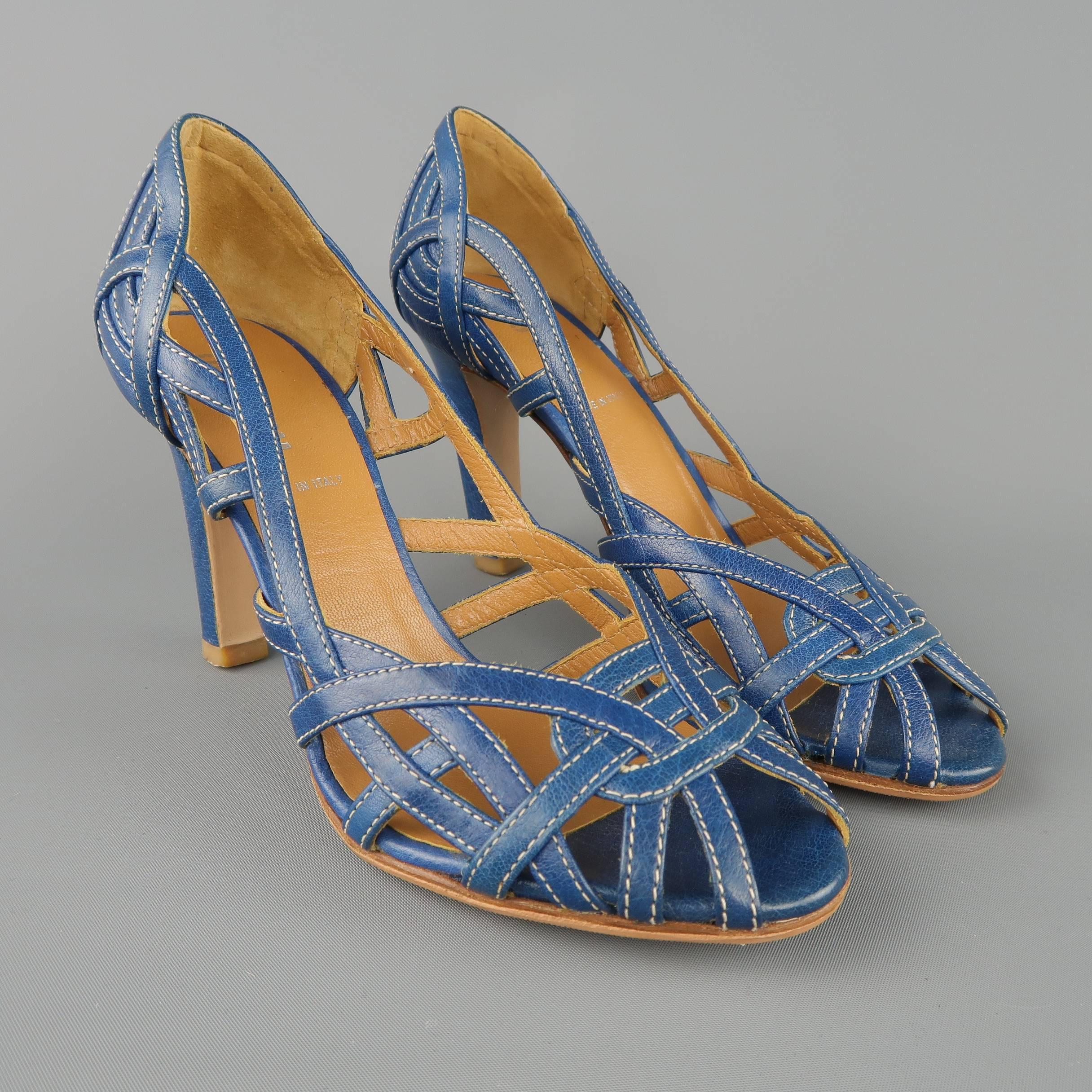 MIU MIU pumps come in woven blue straps with contrast stitching with a peep toe and covered heel. Made in Italy.
 
Excellent Pre-Owned Condition.
Marked: IT 35.5
 
Measurements:
 
Heel: 3.25 in.
