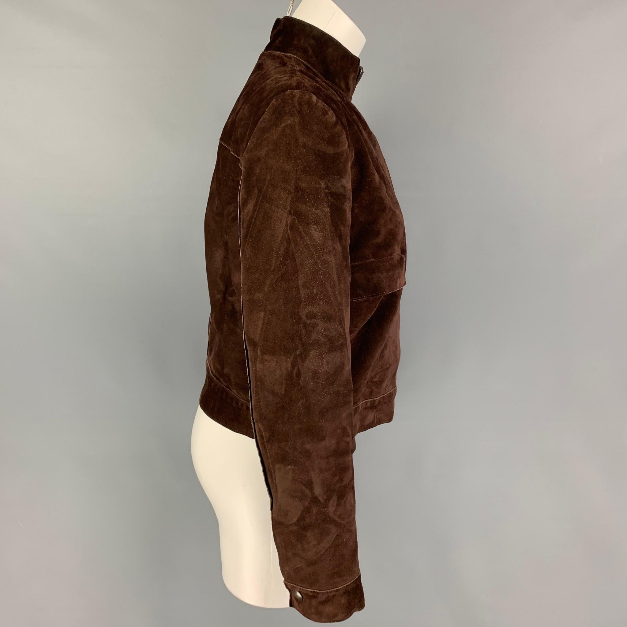 MIU MIU jacket comes in a brown suede with a full liner featuring a belted strap collar, flap pockets, and a snap button closure. Made in Italy. 

Good Pre-Owned Condition. Fabric tag removed.
Marked: 42

Measurements:

Shoulder: 16 in.
Bust: 38