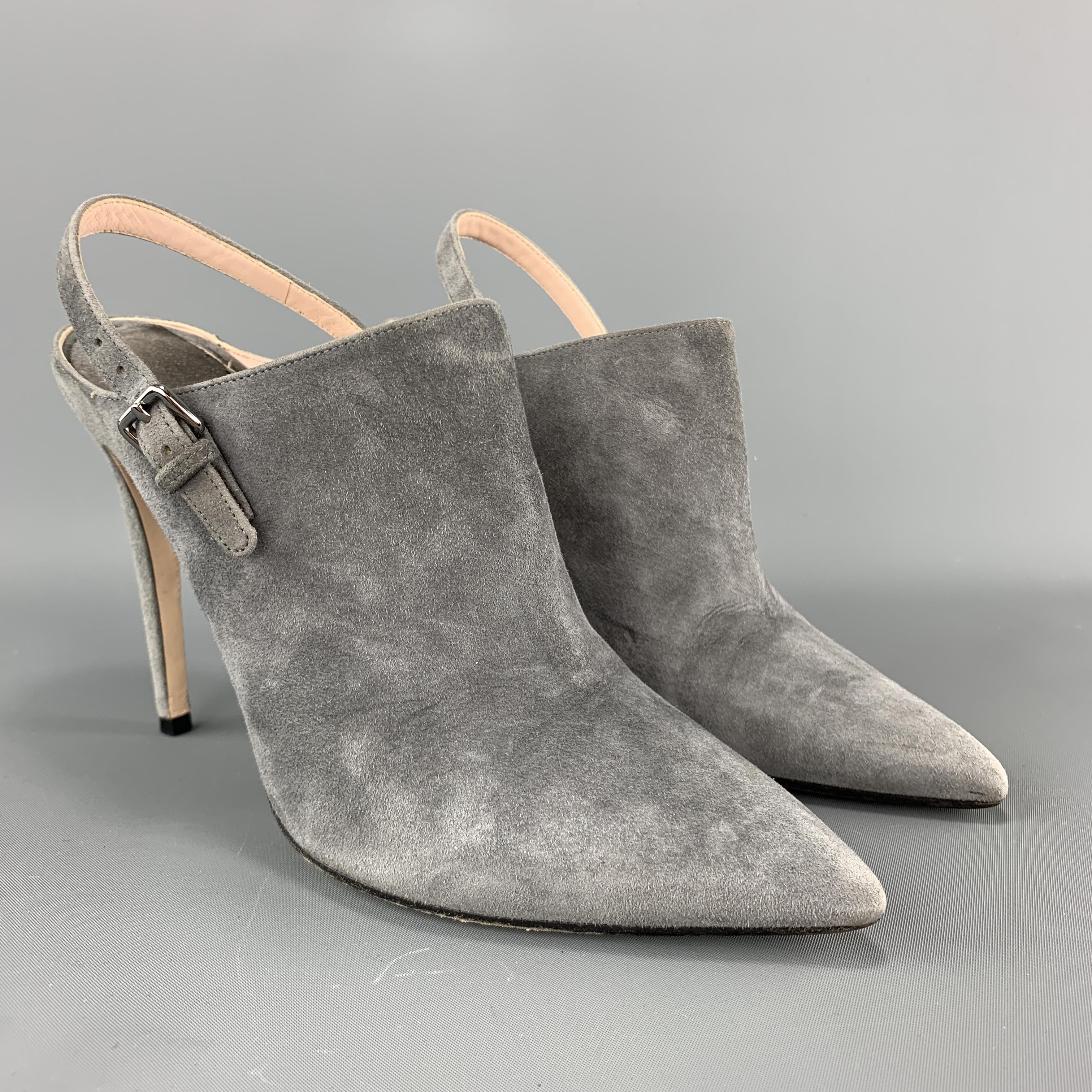 MIU MIU mule booties come in gray suede with a pointed toe, sling back strap, and covered stiletto heel. Made in Italy.

Very Good Pre-Owned Condition.
Marked: IT 37.5

Heel: 4.75 in.