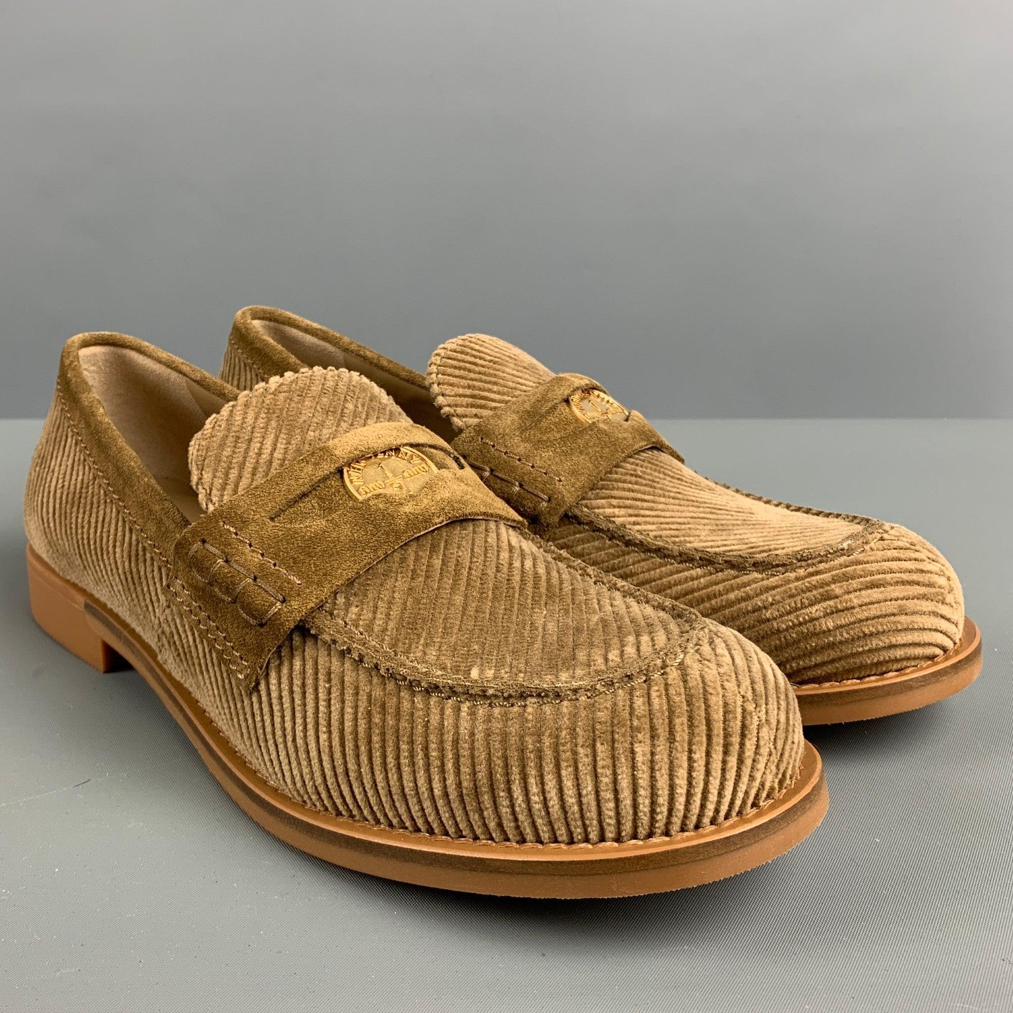 MIU MIU 2023 penny loafers comes in a khaki corduroy featuring a front strap, and slip on. Made in Italy.Excellent Pre-Owned Condition. 

Marked:   37 1/2Outsole: 10.5 inches  x 3.5 inches 
  
  
 
Reference No.: 128195
Category: Flats
More Details
