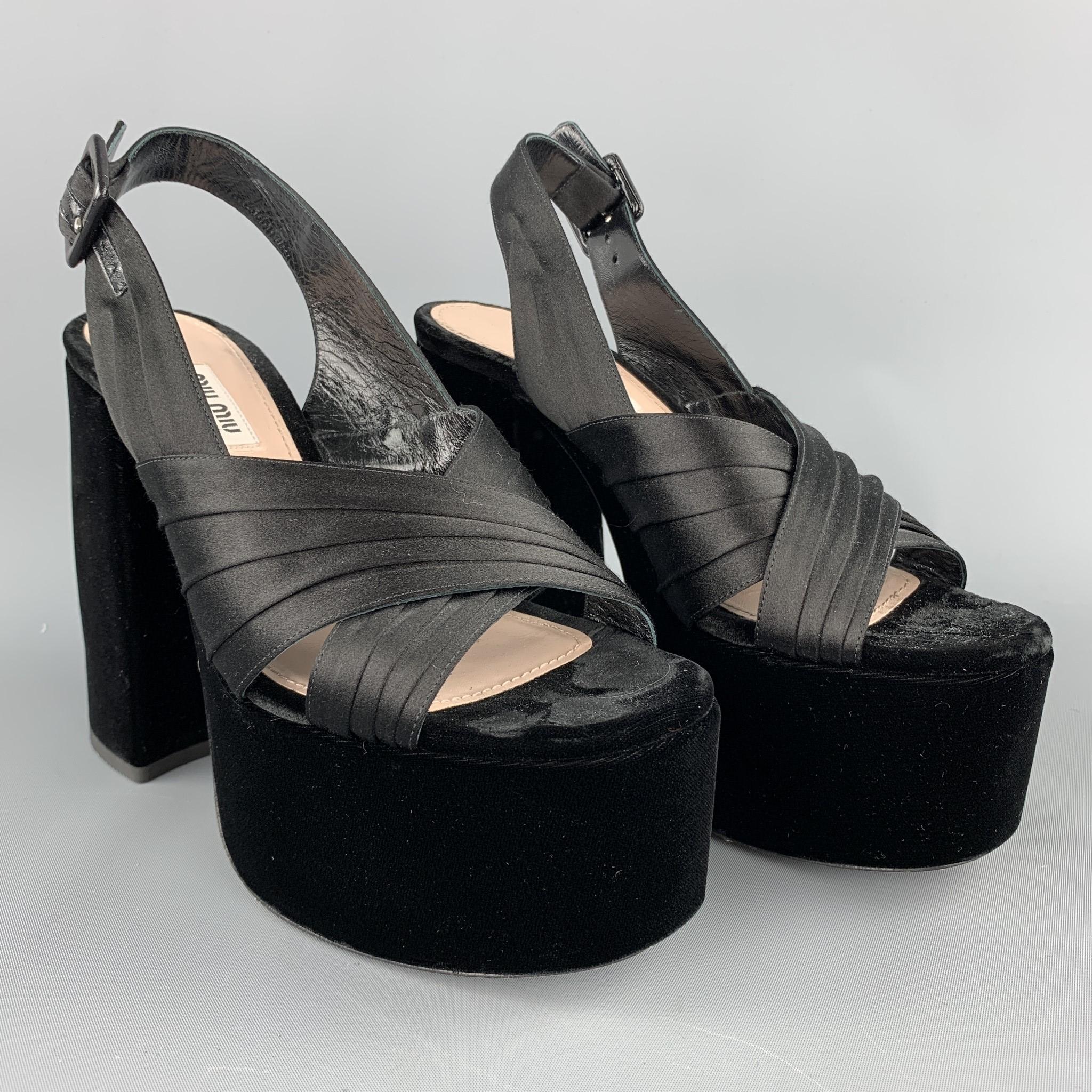 MIU MIU sandals comes black velvet featuring a platform style, chunky heel, and a belt buckle closure. Made in Italy.

Very Good Pre-Owned Condition.
Marked: EU 38
Original Retail Price: $750.00

Measurements:

Heel: 5.5 in. 
Platform: 2.5 in. 