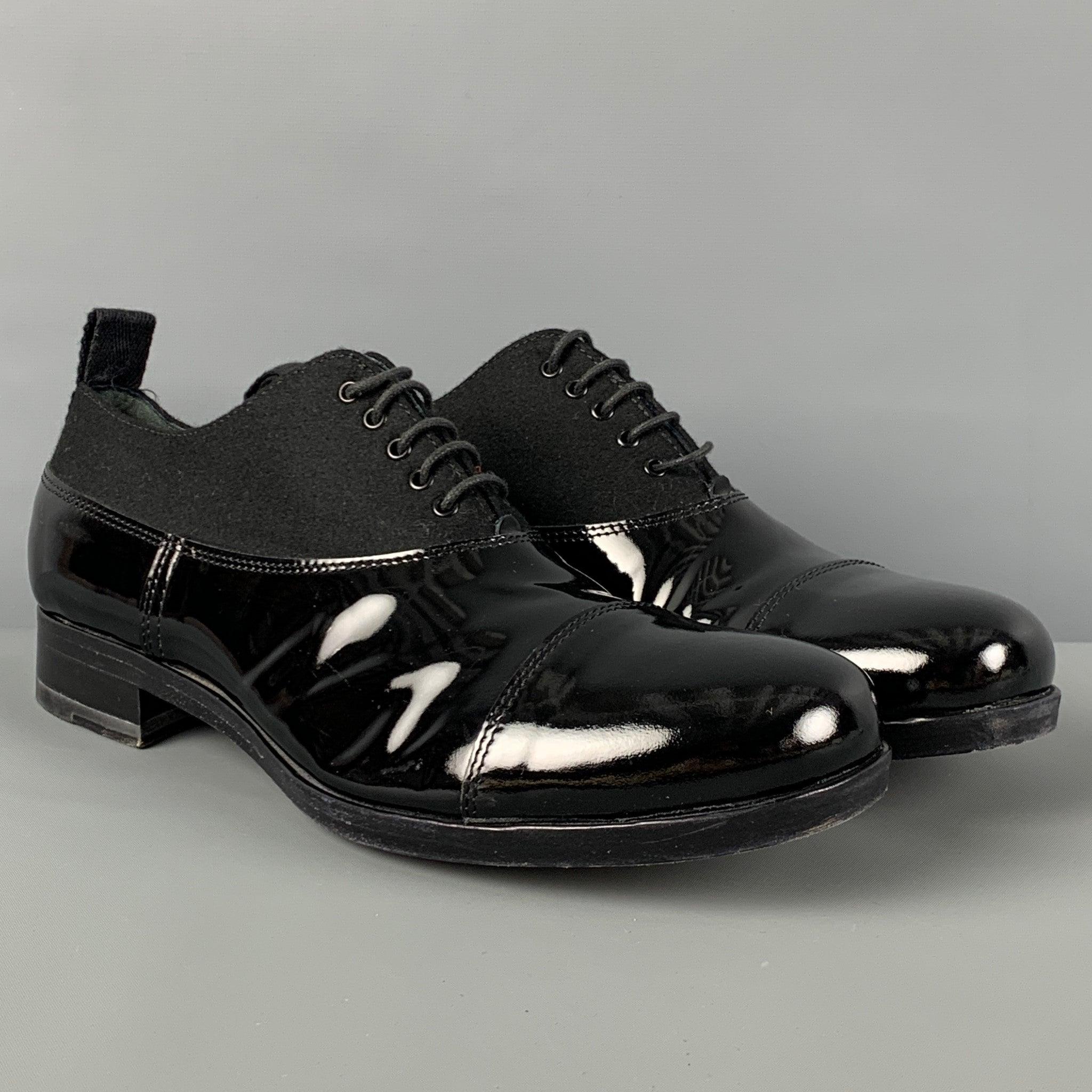 MIU MIU shoes comes in a black patent leather with a wool panel featuring a cap toe and a lace up closure. Made in Italy.
Very Good
Pre-Owned Condition. 

Marked:   8Outsole: 12 inches  x 3.75 inches 
  
  
 
Reference: 123279
Category: Lace Up