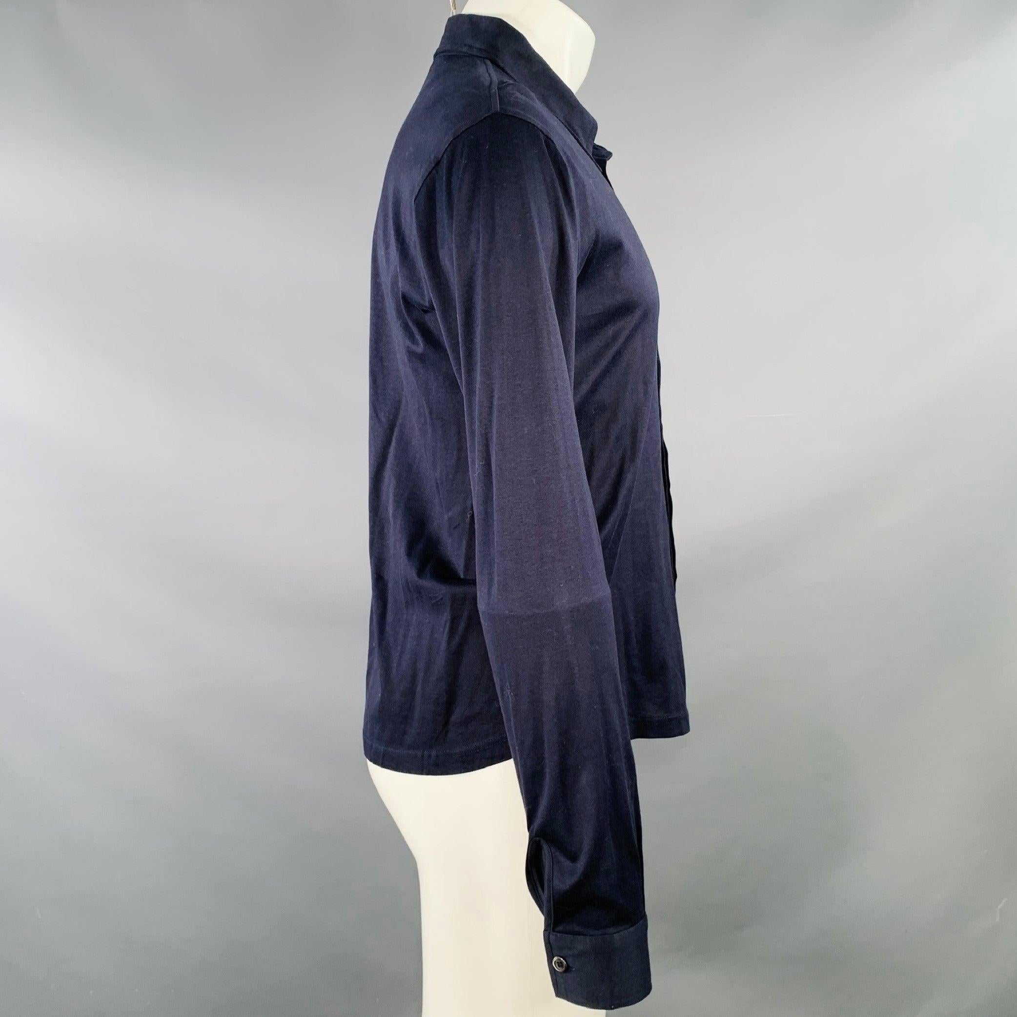 MIU MIU long sleeve shirt
in a navy cotton jersey featuring a pointed collar, and button closure. Made in Italy. Note: this garment has been professionally altered. Please double check measurements.
Excellent Pre-Owned Condition. 

Marked:   XL.