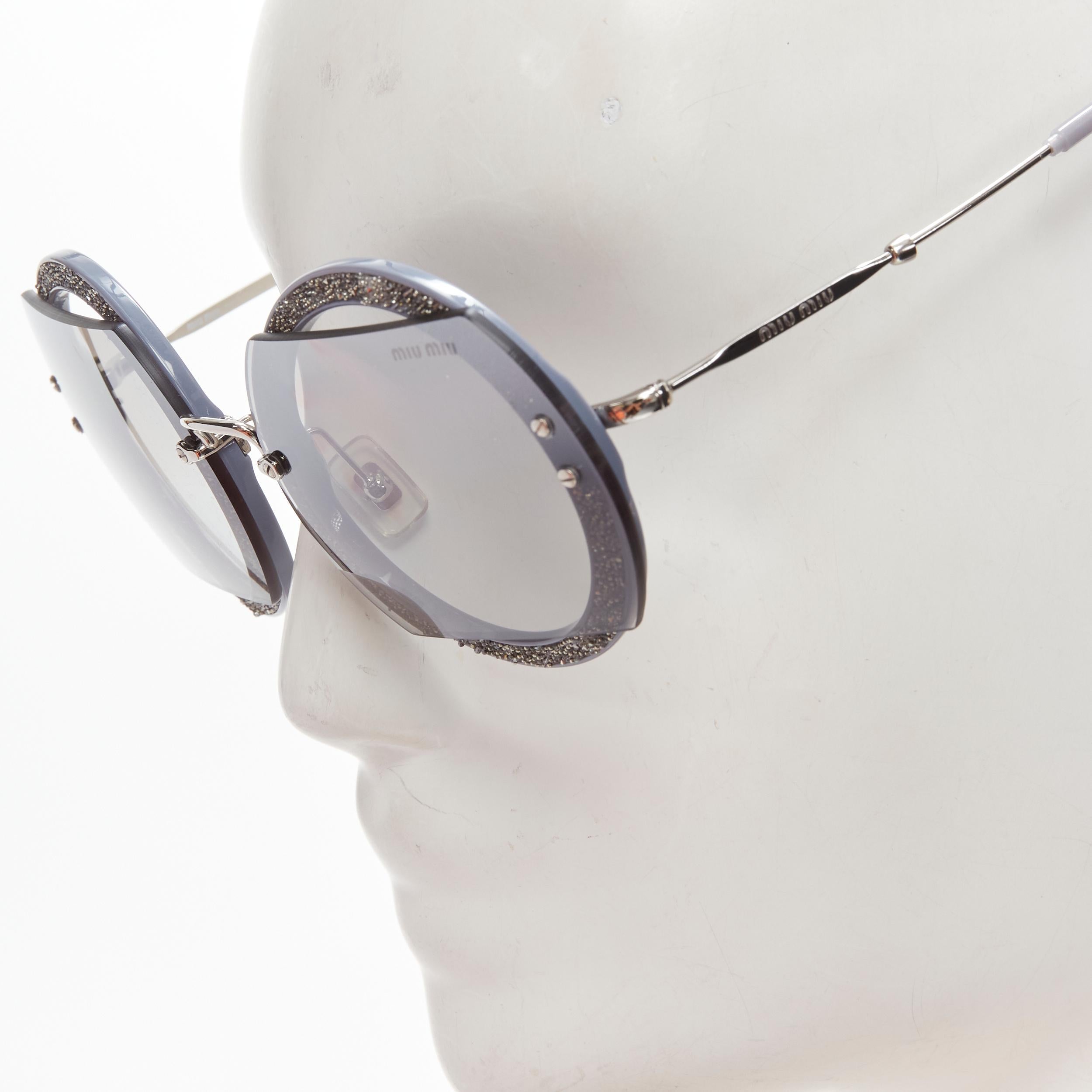 MIU MIU SMU06S dark silver embellished circle frame rounded sunglasses 
Reference: ANWU/A00066 
Brand: Miu Miu 
Designer: Miuccia Prada 
Material: Acetate 
Color: Silver 
Pattern: Solid 
Made in: Italy 


CONDITION: 
Condition: Excellent, this item