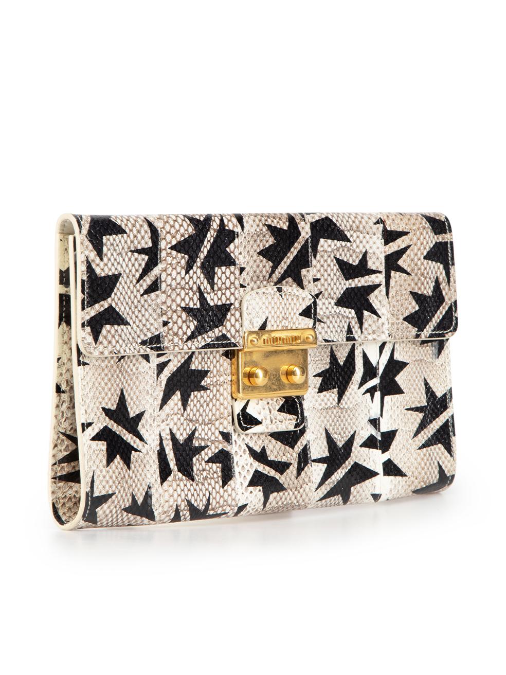 CONDITION is Very good. Minimal wear to clutch bag is evident. Minimal wear to surface print with some mild colour dispersion around the stars. Very light hardware tarnishing also seen at clasp on this used Miu Miu designer resale item.
