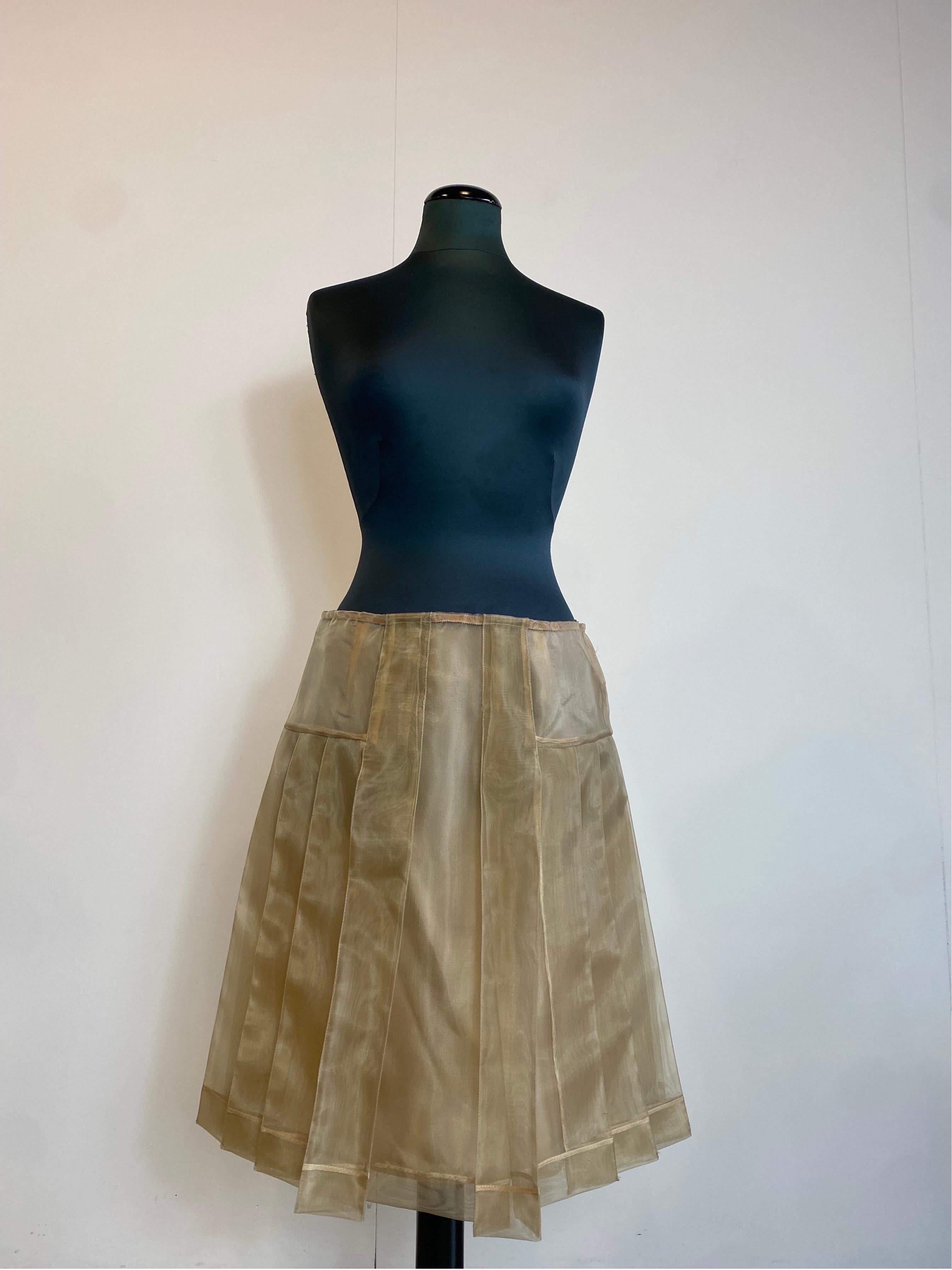 MIUMIU skirt.
Spring summer 2000 collection.
Made of polyamide. With silk underskirt (has some pulled threads).
Italian size 42.
Waist 42cm
Length 57 cm
New, still has original brand tag and 10 Corso Como where it was purchased.