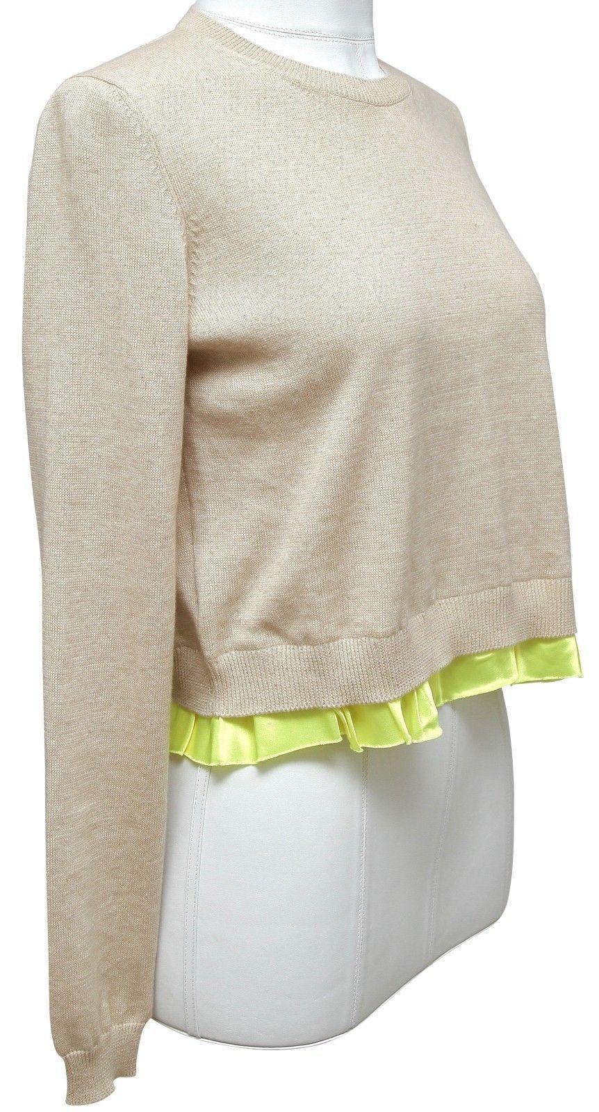 GUARANTEED AUTHENTIC MIU MIU TAN KNIT

Retail excluding tax $515


Details:
• Tan cotton long sleeve crewneck sweater that has a great easy fit.
• Yellow viscose ruffle trim around hem.
• Lightweight.

Material: 100% Cotton; 100% Viscose Trim

Size: