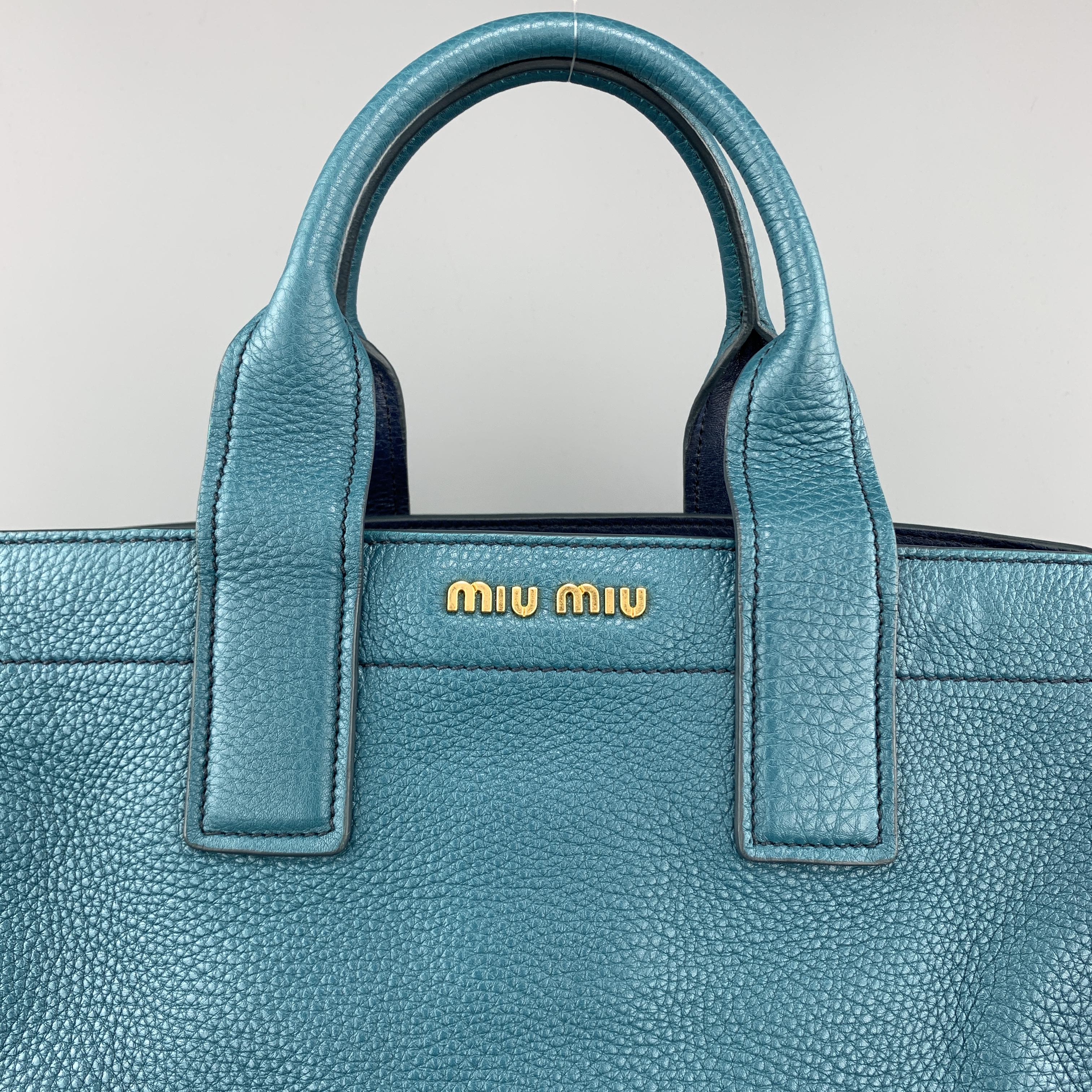 MIU MIU handbag comes in two tone teal and navy 