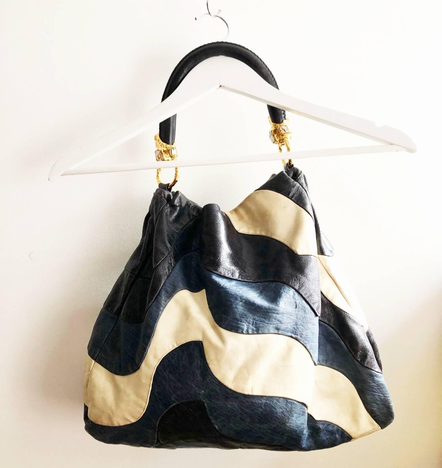 FREE UK and WORLDWIDE DELIVERY 
miu miu tri colour leather shoulder bag, blue and black wave design, gold tone logo on side, gold tone metal ware with beautiful stones, the bag is an stunning item. it adds a twist to a denim outfit yest