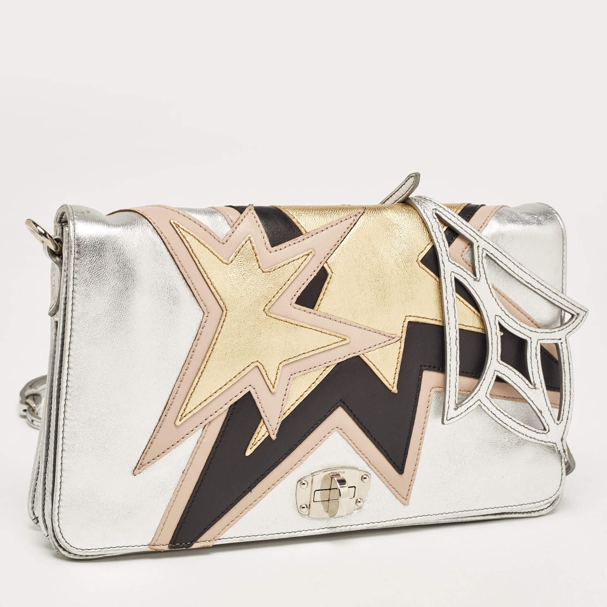 Be a star and steal the show with this stylish and glam shoulder bag. This is a Miu Miu diagonal shoulder bag with a distinctive strap. It has a twist-lock in the front and a spacious compartment space within for your valuables. The creation will go